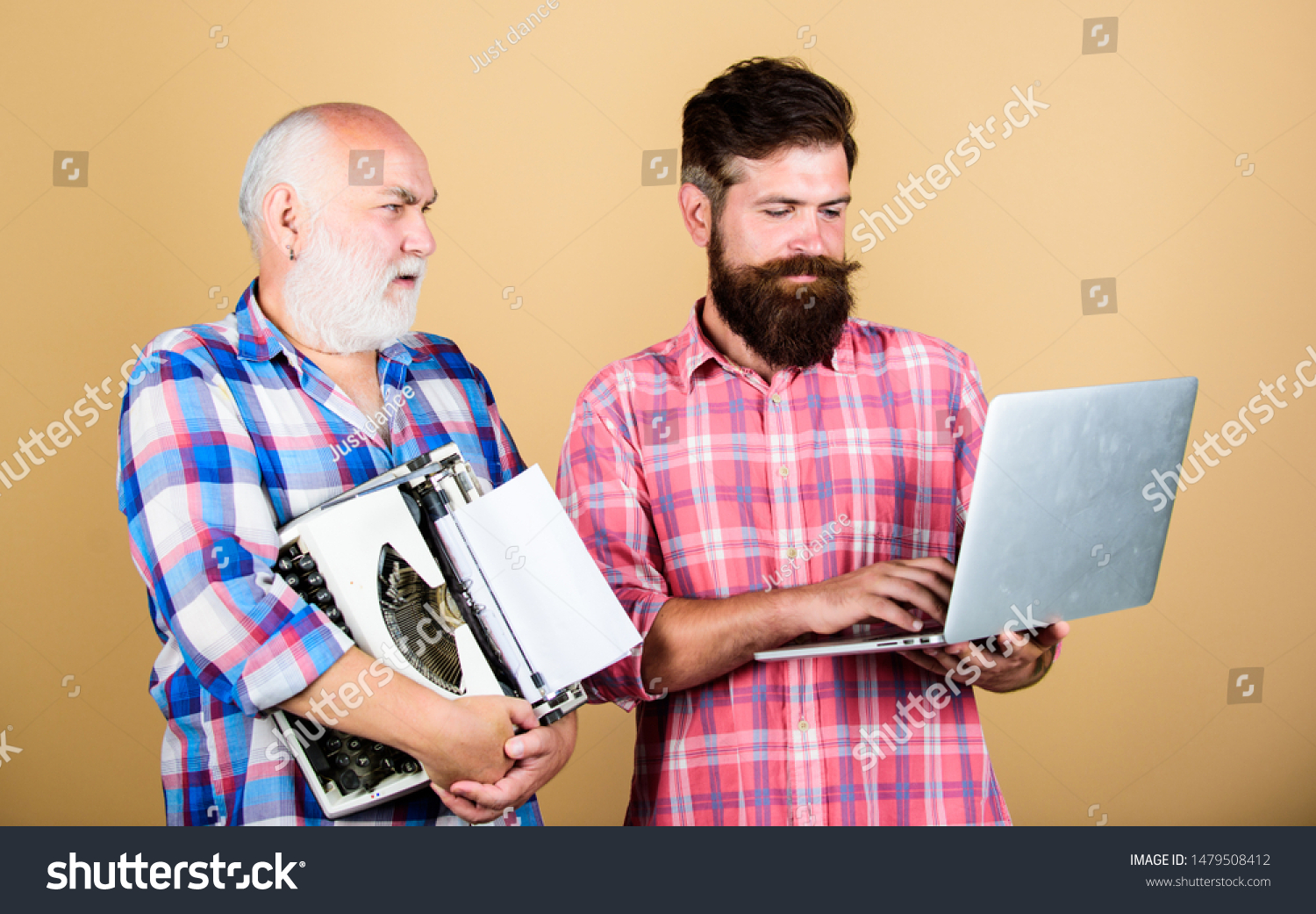 master service. youth vs old age. business approach. father and son. family generation. retro typewriter vs laptop. New technology. technology battle. Modern life. two bearded men. Vintage typewriter. #1479508412