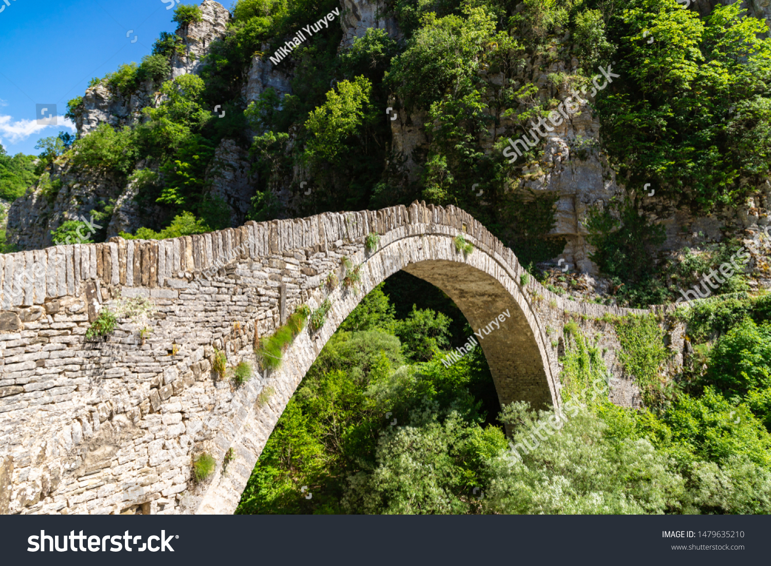 Bridge of Kokkoros or Noutsos in Epirus mountain greek region. One-arch stone bridge situated on the river of Voidomatis in the municipality of Central Zagori. Zagorohoria, Greece. #1479635210