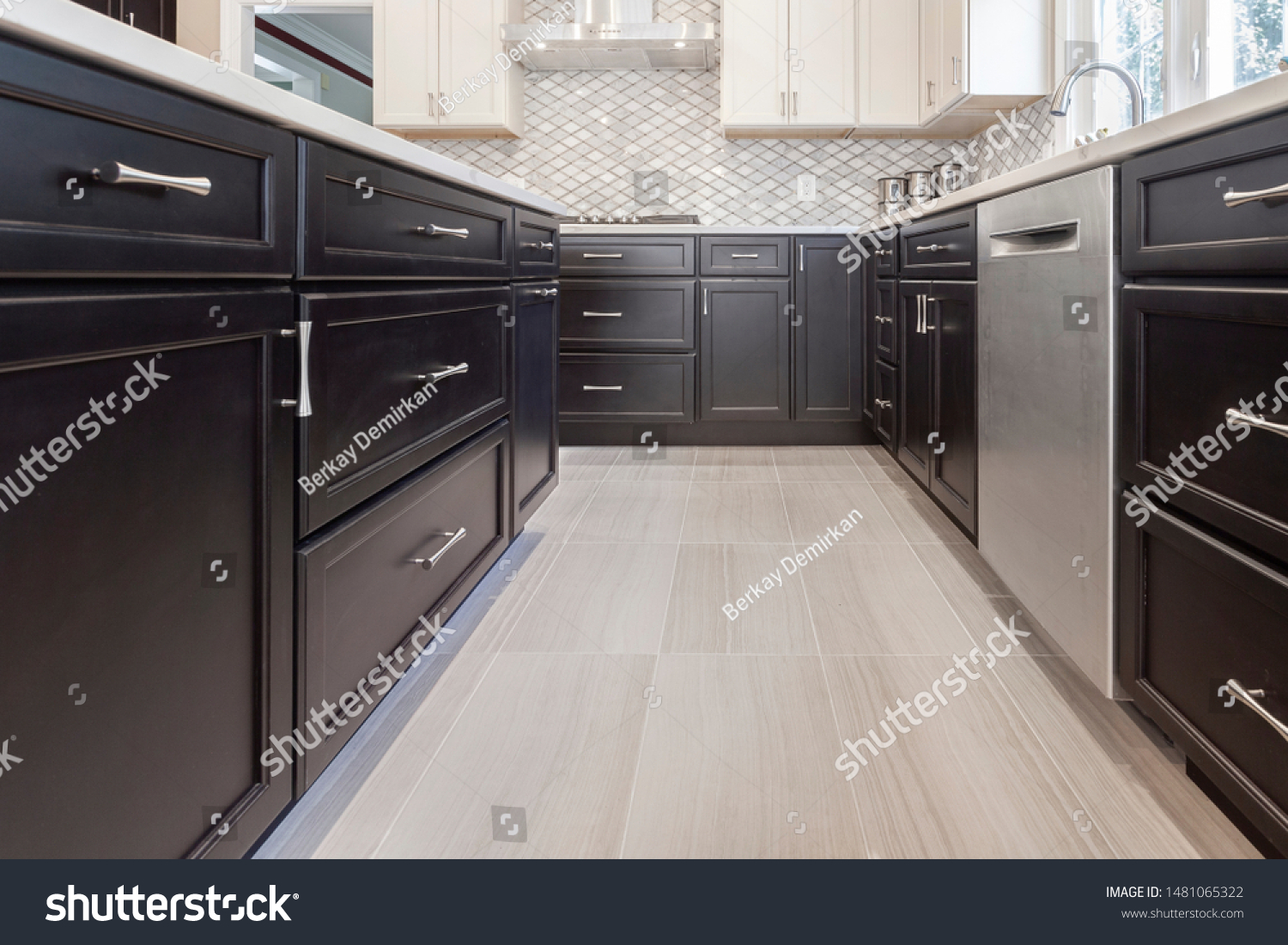 Brown / Espresso and white modern kitchen cabinets with shaker door style and stainless steel appliances with porcelain floors #1481065322