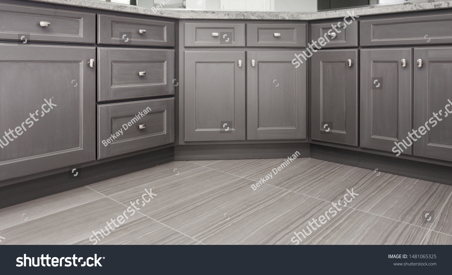 gray shaker style kitchen / vanity / bathroom cabinet with chrome color rectangular handles, porcelain floor tiles #1481065325