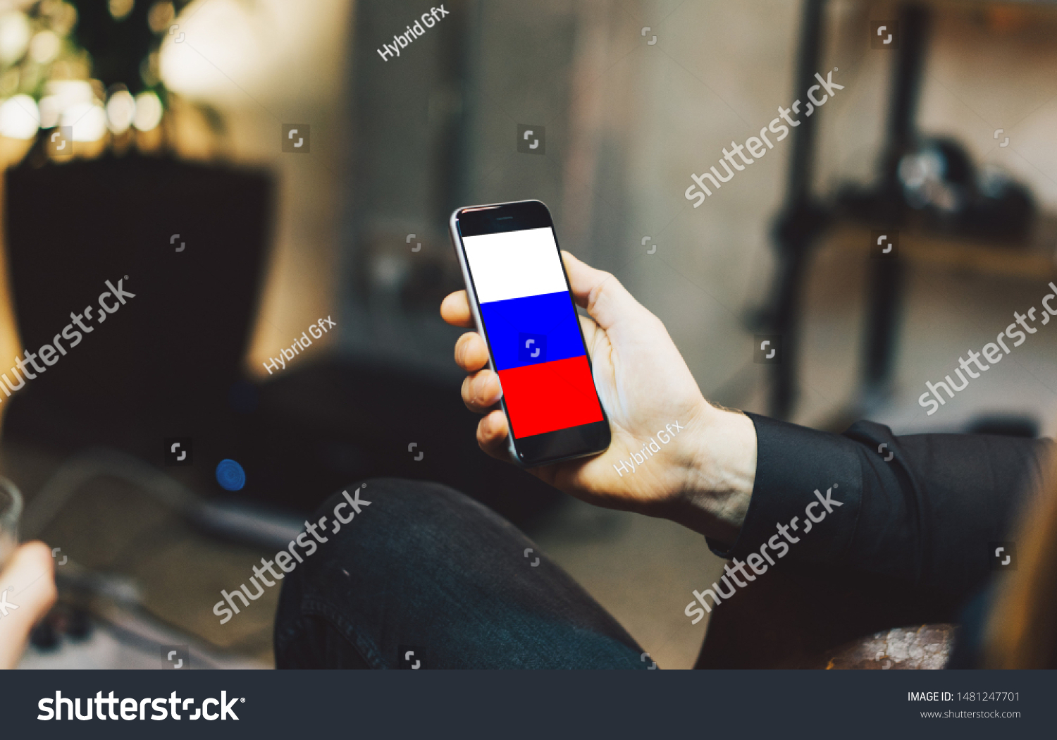 Man holding Smartphone with Flag of Russia. Russia Flag on Mobile Screen. #1481247701