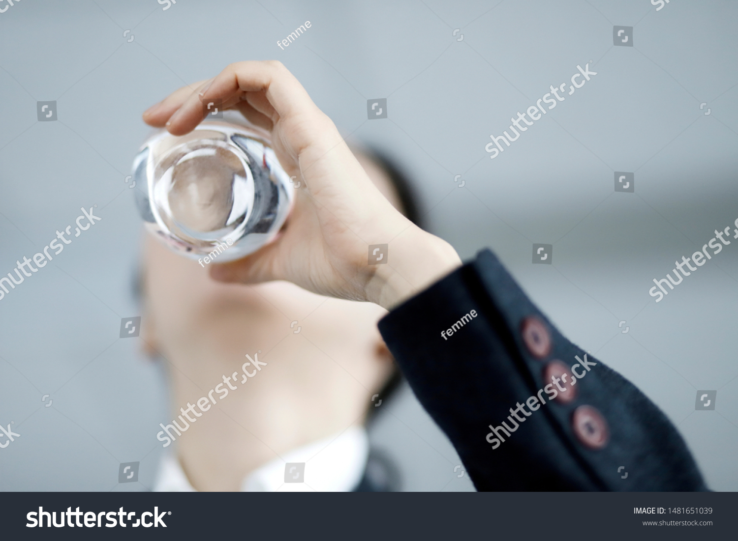 Businesswoman drinking glass of water #1481651039