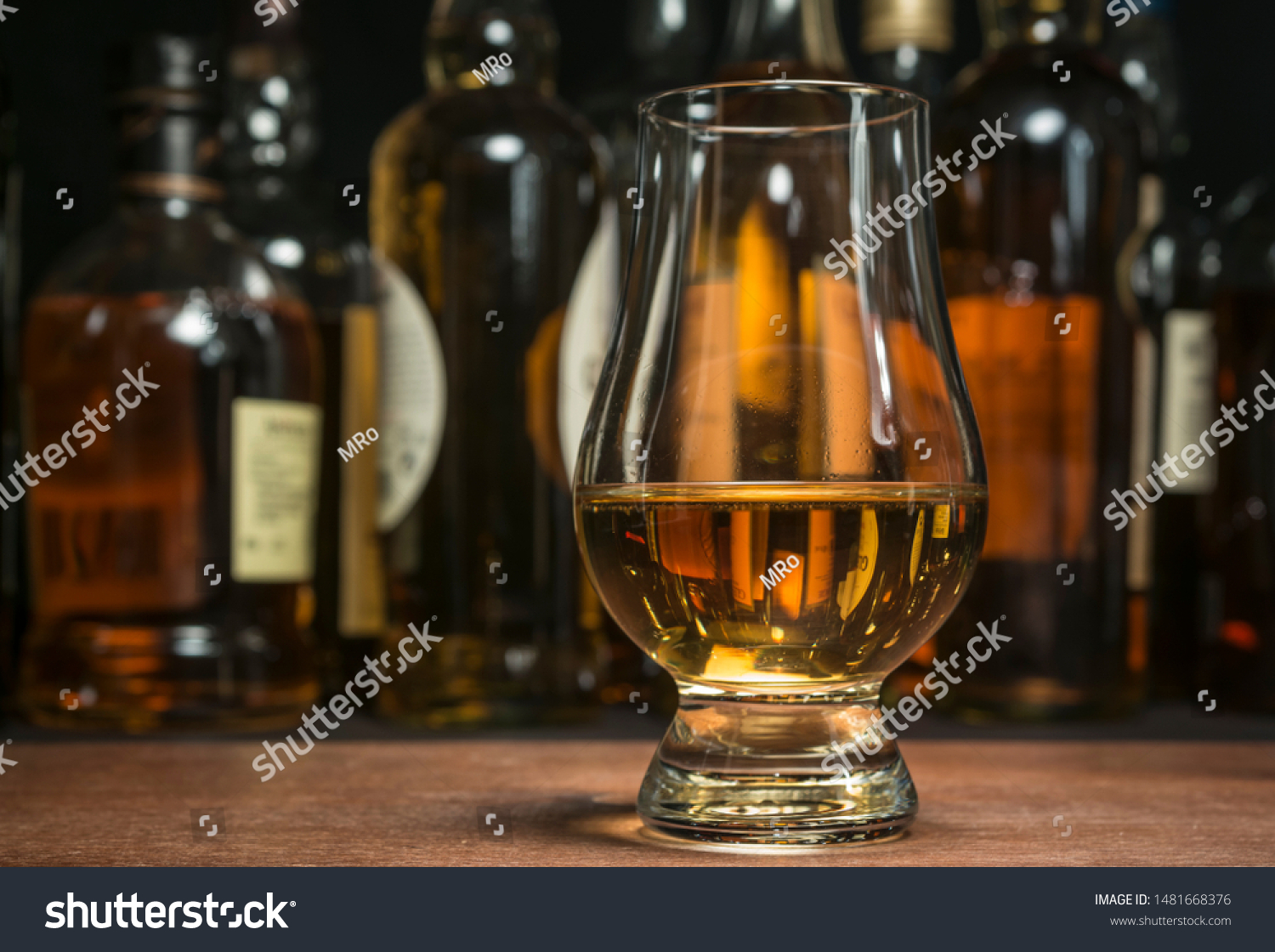 Scotch whisky in a traditional tasting glass. #1481668376
