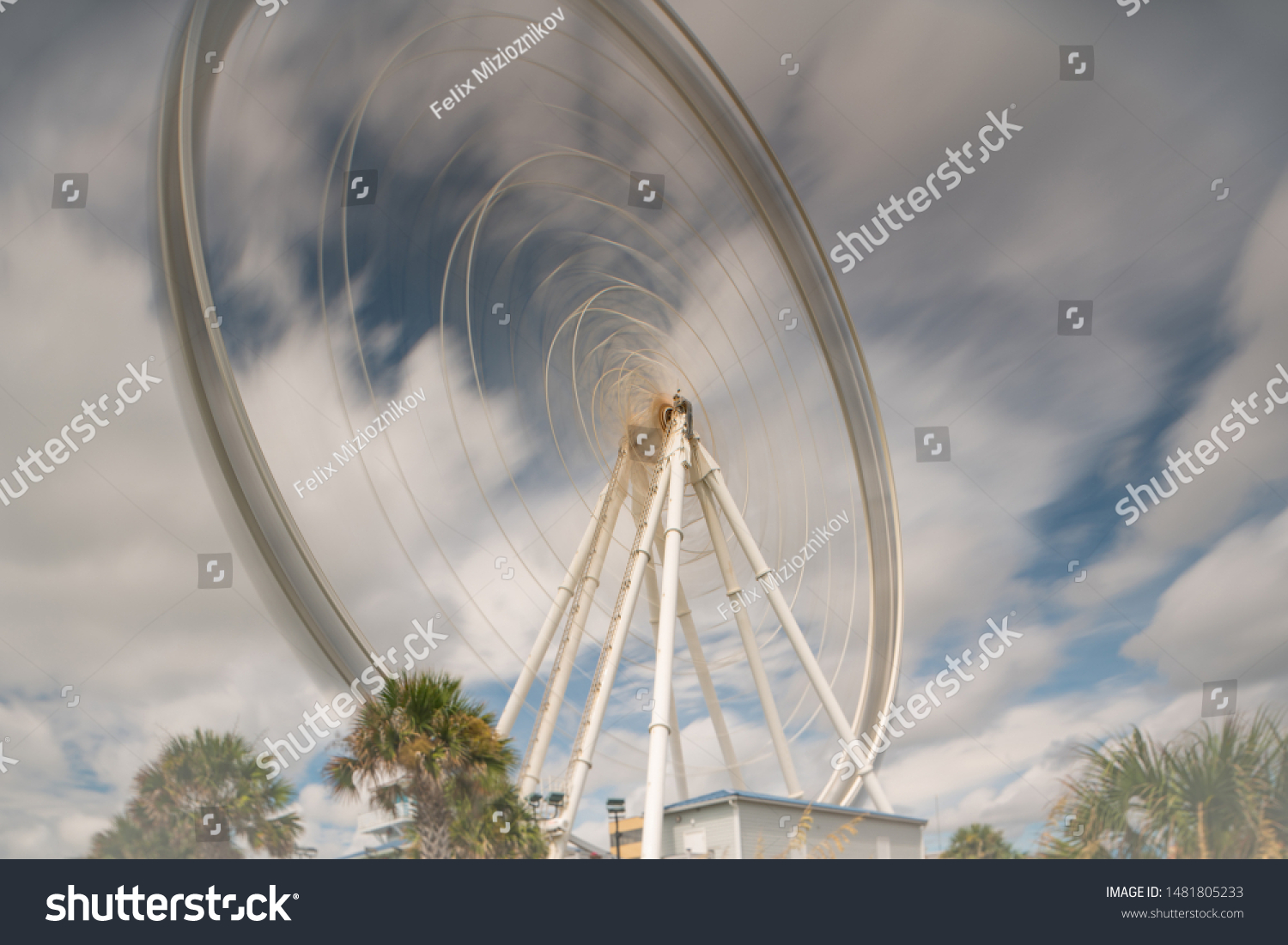 Long exposure ferris wheel in motion #1481805233