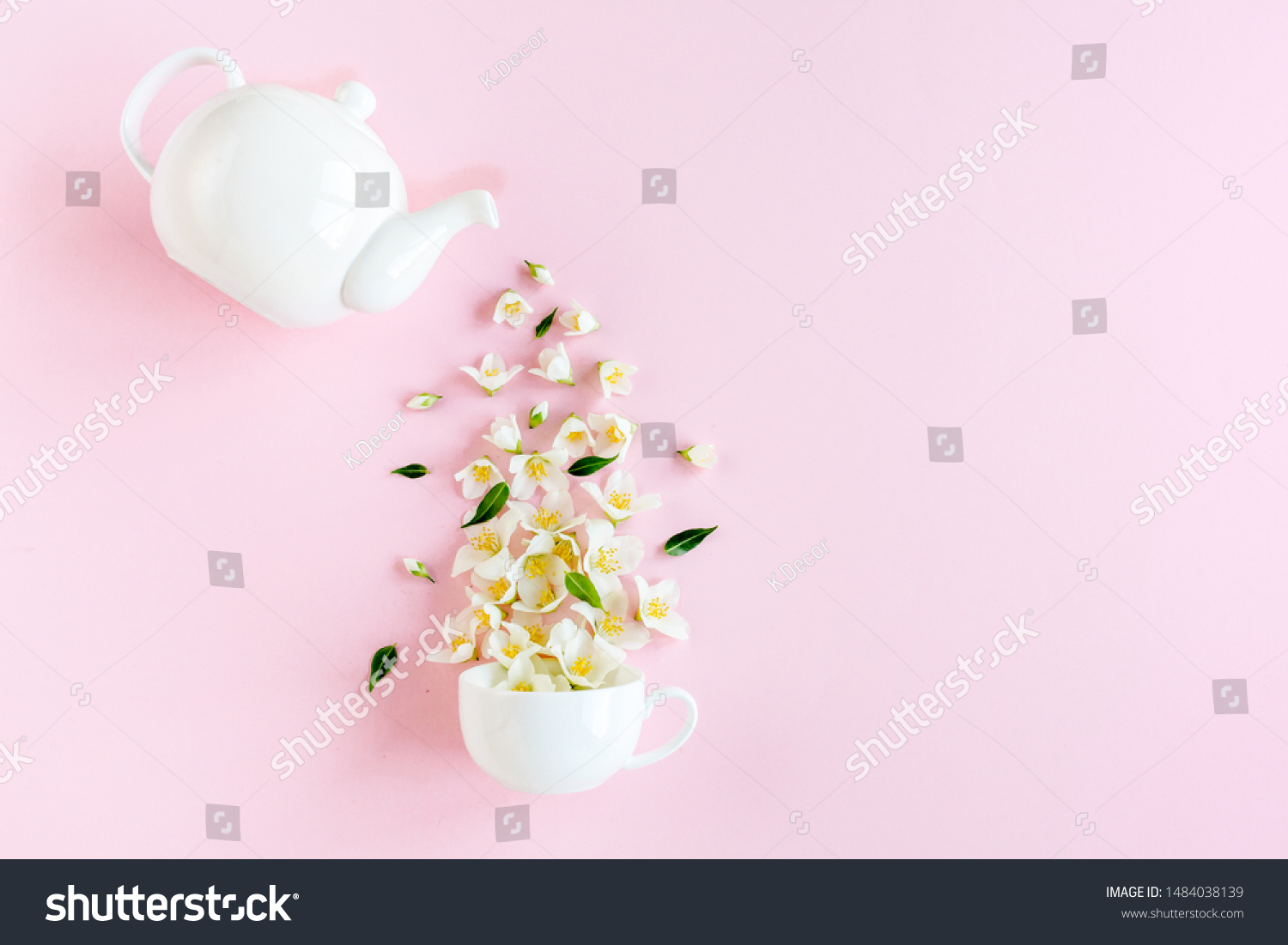 Creative layout of teapot and tea Cup with Jasmine flowers on a pink background. Jasmine tea. #1484038139