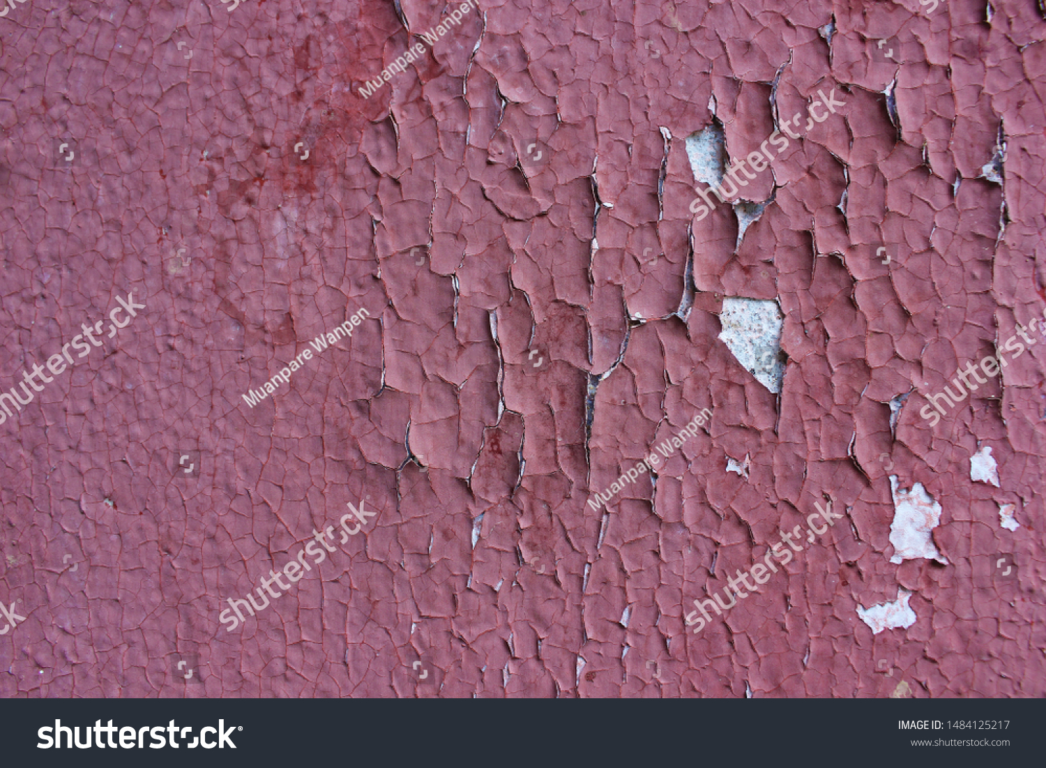 The walls of the old house red color cracked. cracked plaster as a background or texture. Old painting cracked. #1484125217