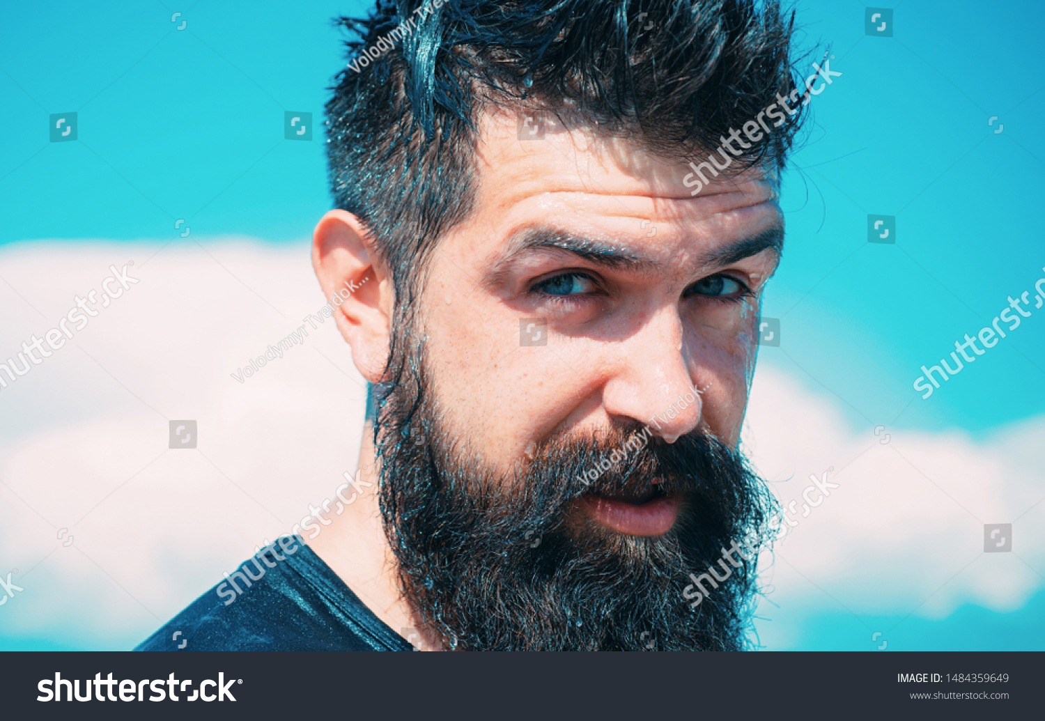 Trendy hairstyle for bearded man. Bearded man on sunny sky background. Brutal caucasian hipster with wet beard and mustache hair on bearded face. #1484359649