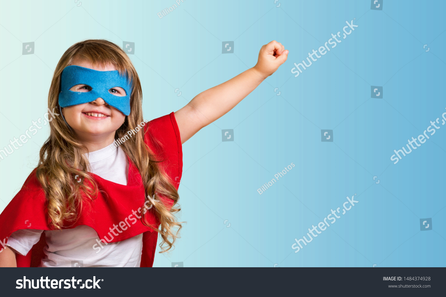 Little child superhero with yellow cloak and star. Happy smiling kid in glasses ready for education. Success, motivation concept. Back to school. Little businessman isolated on blue, Boy superhero. #1484374928