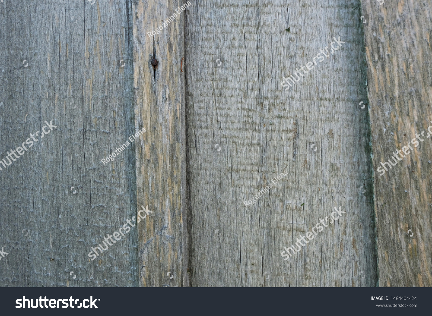Old, gray weathered boards. A fence of retro bars. Texture background. Сlose-up. Horizontal. #1484404424