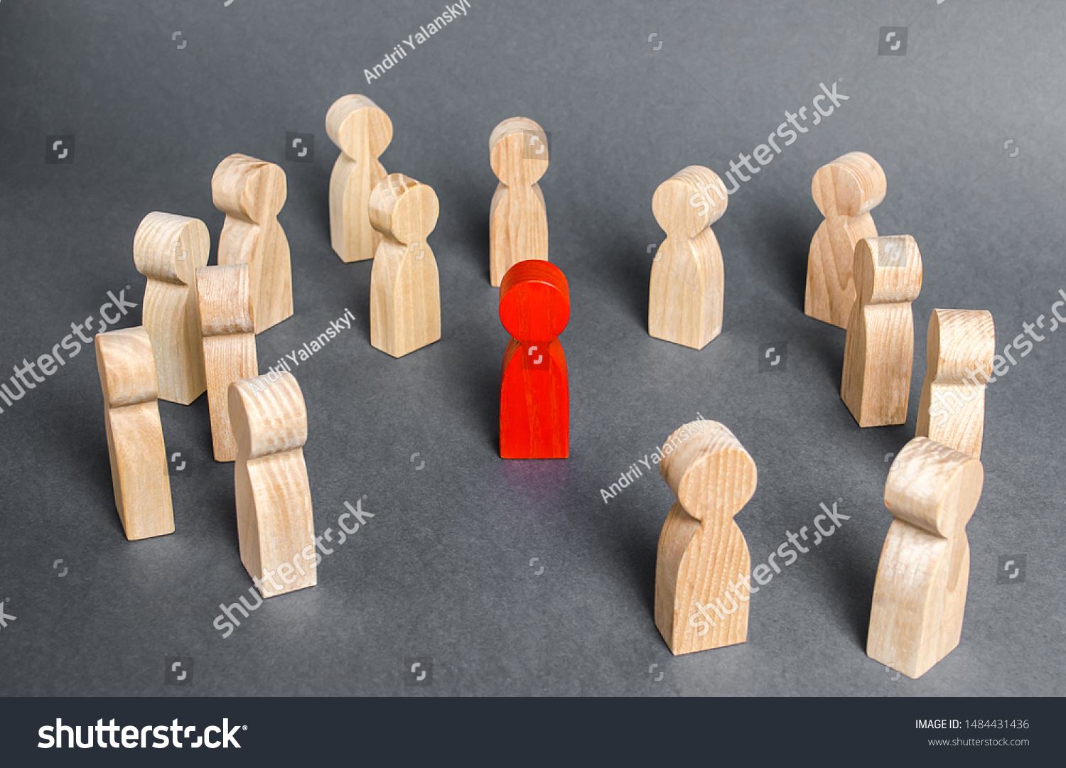 Red human figure surrounded by a group of people. Leader Boss and leadership. Cooperation and teamwork. Outcast, hated opponent, criminal. Conviction. Discrimination and violence. #1484431436