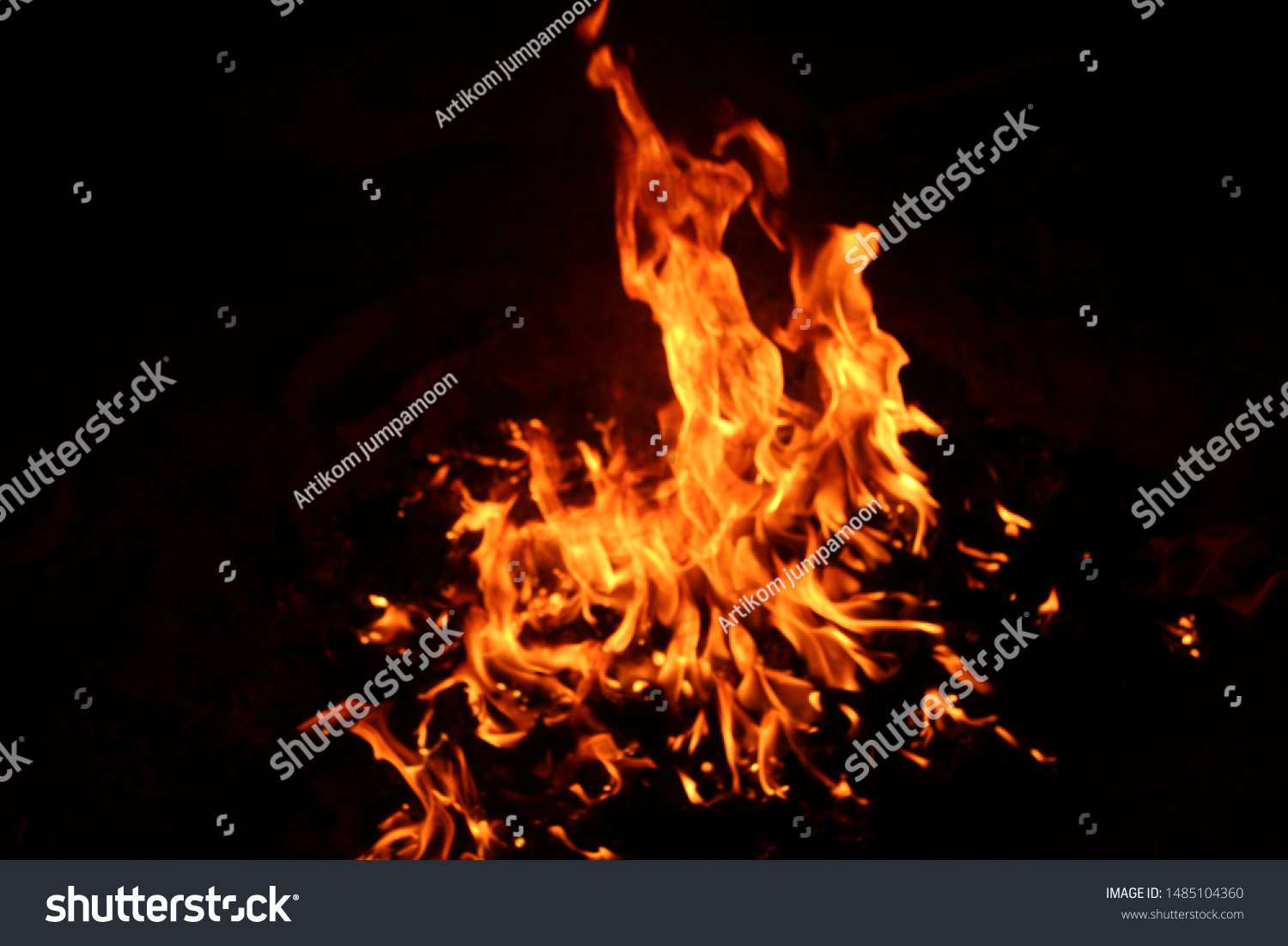 The flames of flaming flames swept through various shapes like hot, energy on a black background. #1485104360