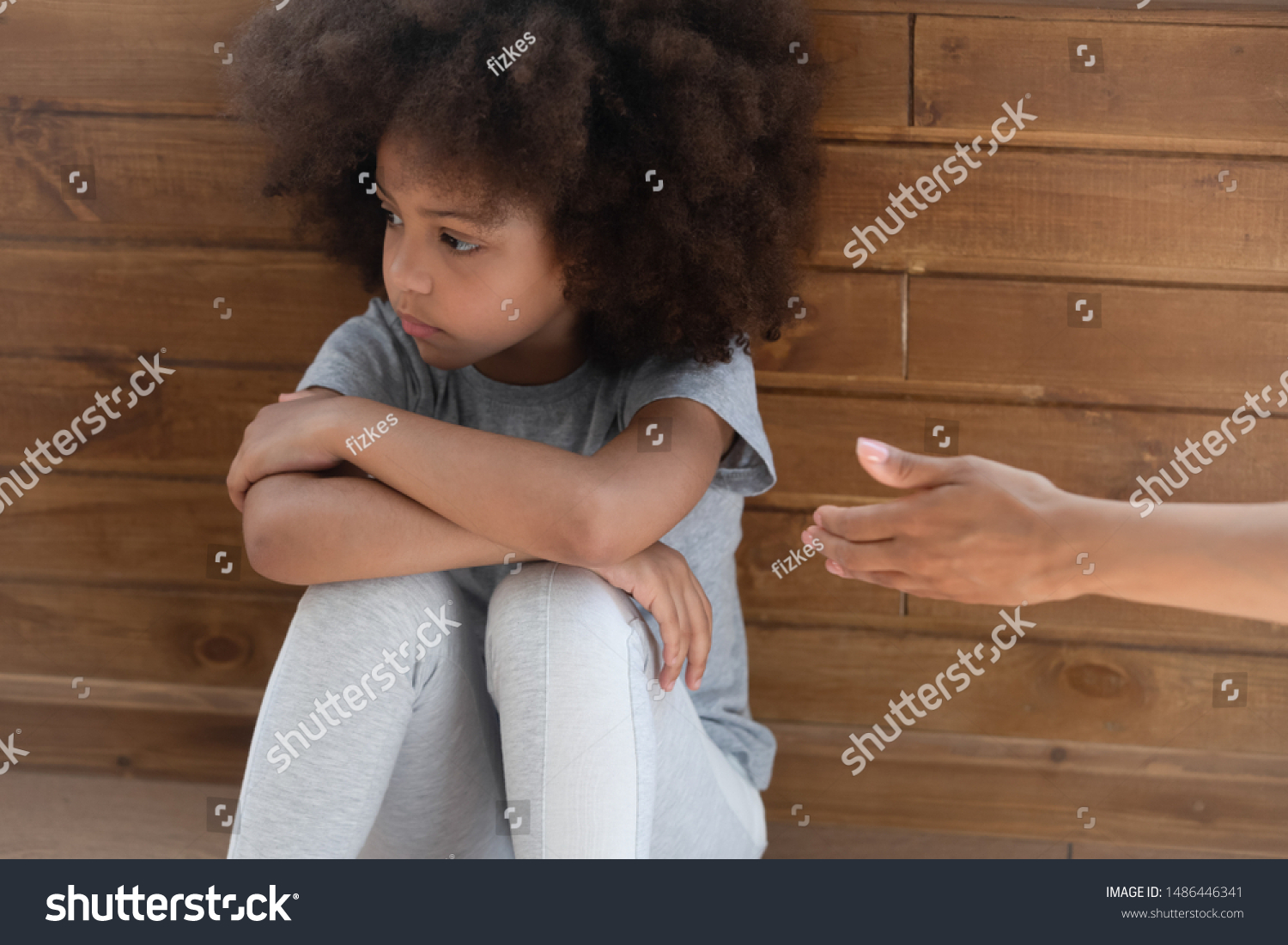 Upset african american little adorable kid girl ignoring lent mommys hand. Offended unhappy mixed race child suffering from quarrel, does not want to forgive, feeling stressed and misunderstood. #1486446341