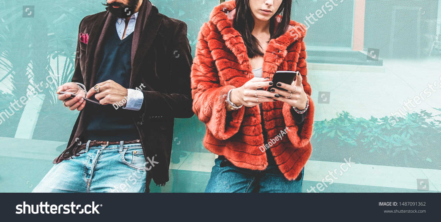 Fashion influencers people using smartphone social media app - Young trendy couple watching story video on mobile cell phone - Technology trends, marketing and new digital job concept - Focus on hands #1487091362
