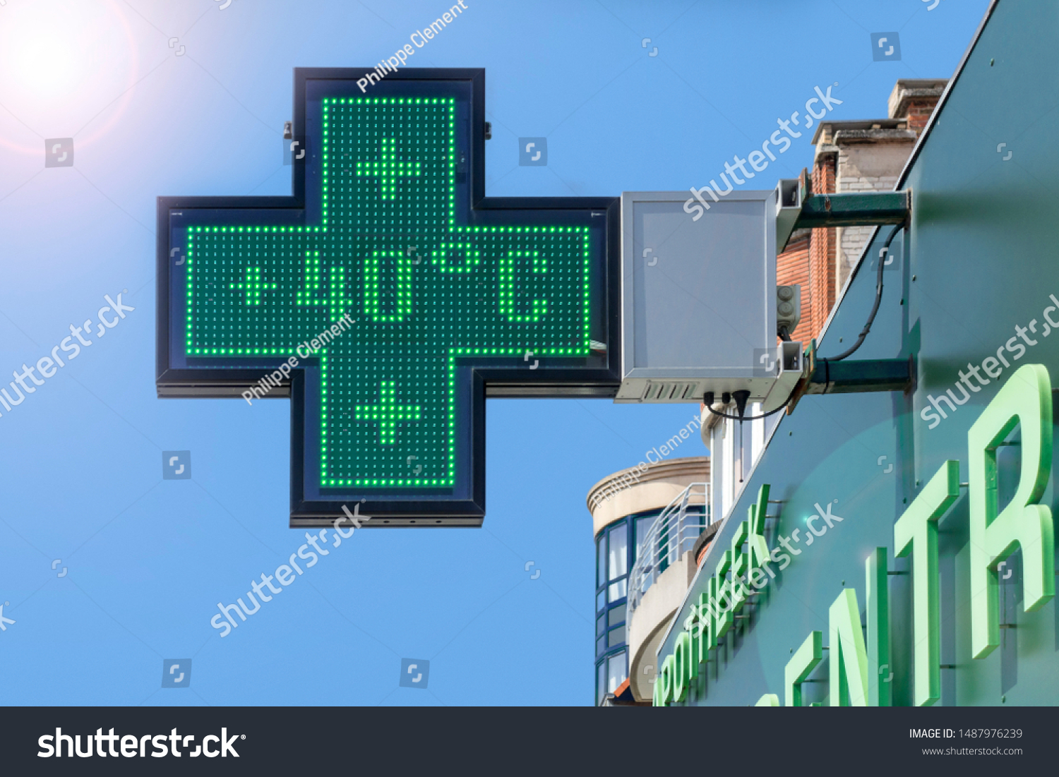 Thermometer in green pharmacy screen sign displays extremely hot temperature of 40 degrees Celsius during heatwave / heat wave in summer in Belgium #1487976239