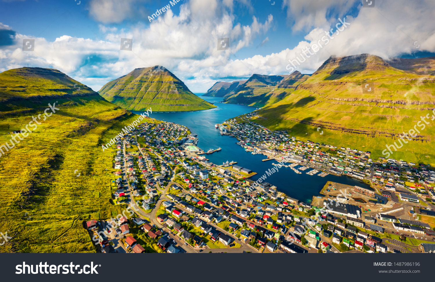 View from flying drone. Sunny summer cityscape of Klaksvik town. Aerial morning scene of Bordoy island, Faroe, Kingdom of Denmark, Europe. Traveling concept background.
 #1487986196