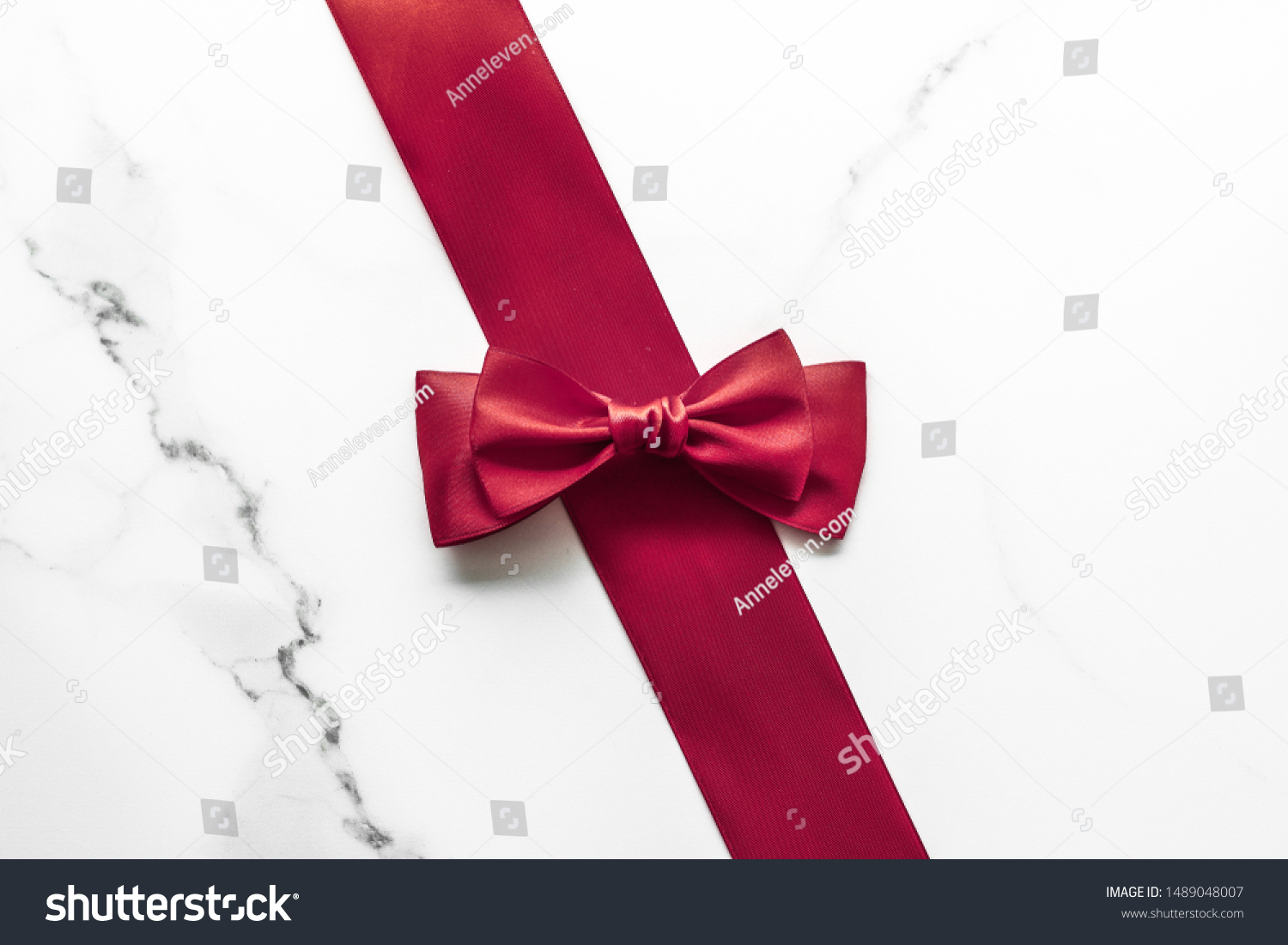 Holiday gift, decoration and sale promotion concept - Bordeaux silk ribbon on marble background, flatlay #1489048007