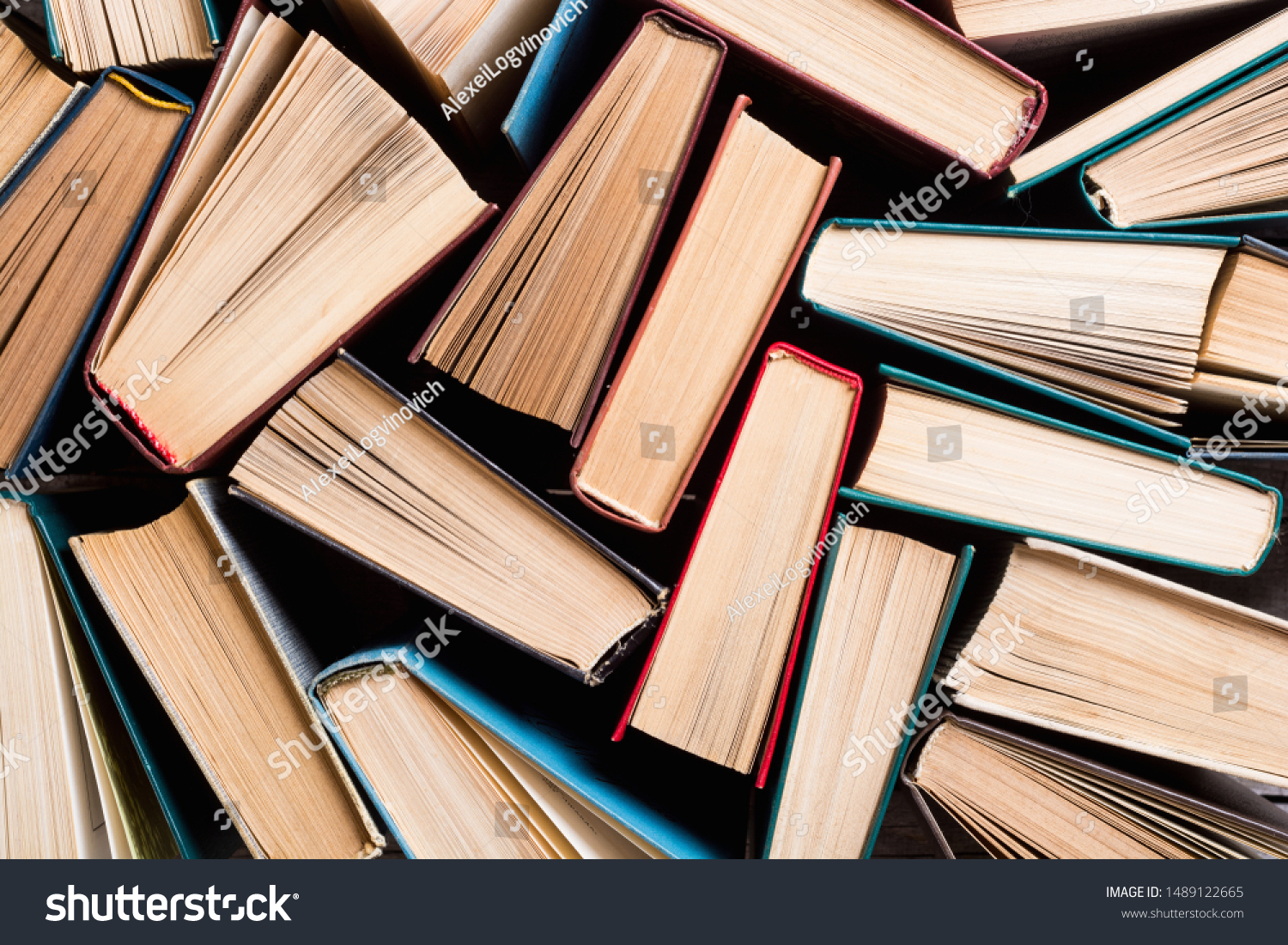 Collection of old books in library . Education background #1489122665