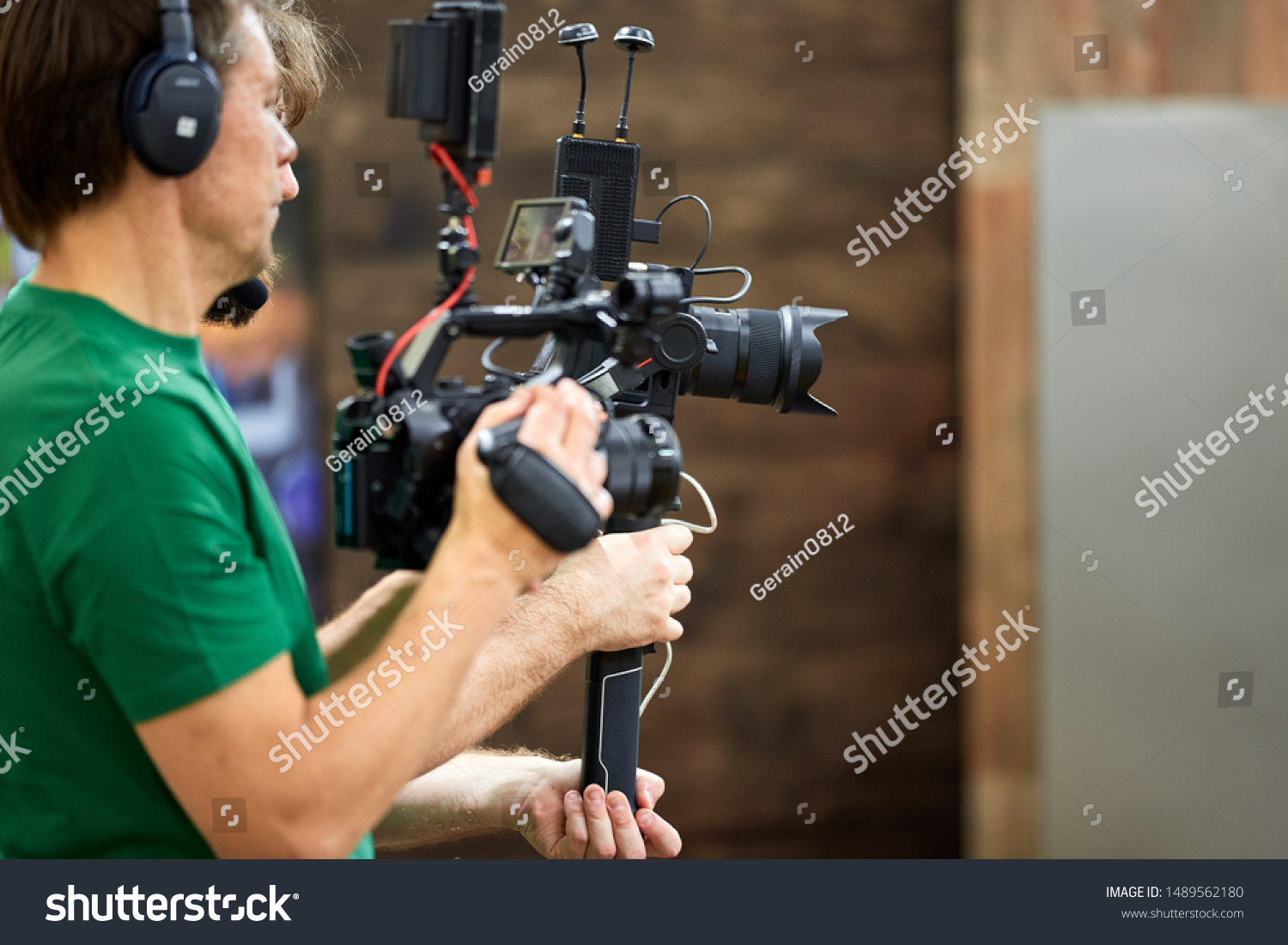 Behind the scenes of filming films or video products and the film crew of the film crew on the set in the pavilion of the film studio. #1489562180