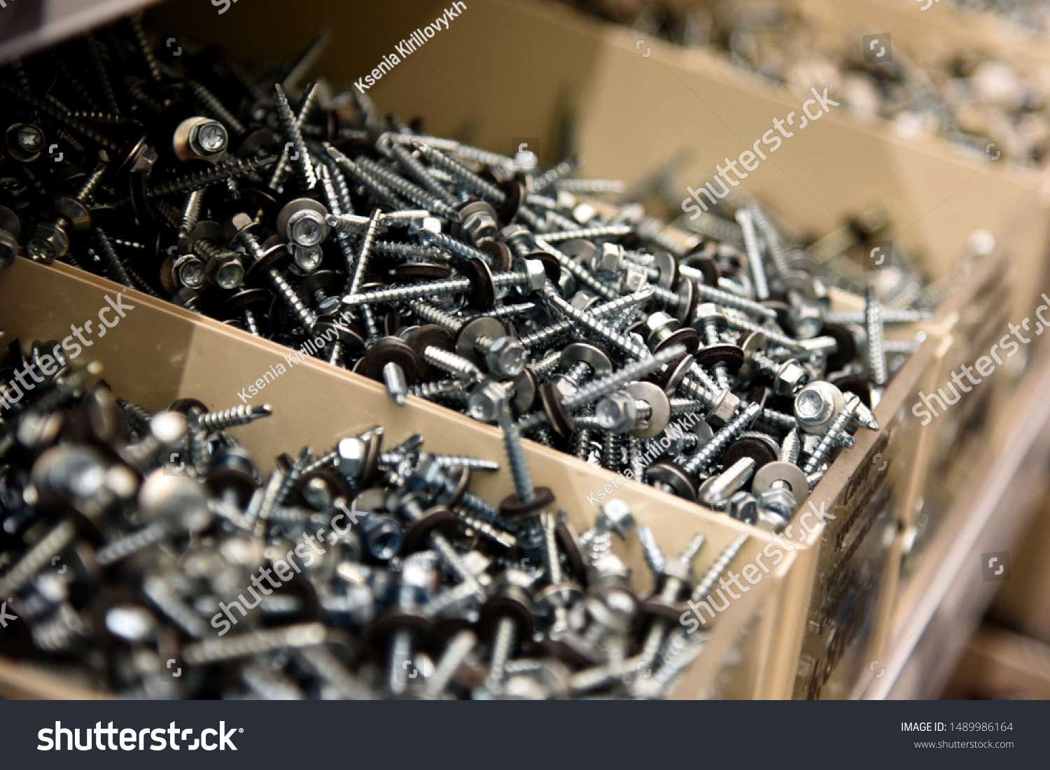 a lot of nails and screws in boxes. tools for repair. men's business. building. hobby . Selective focus #1489986164