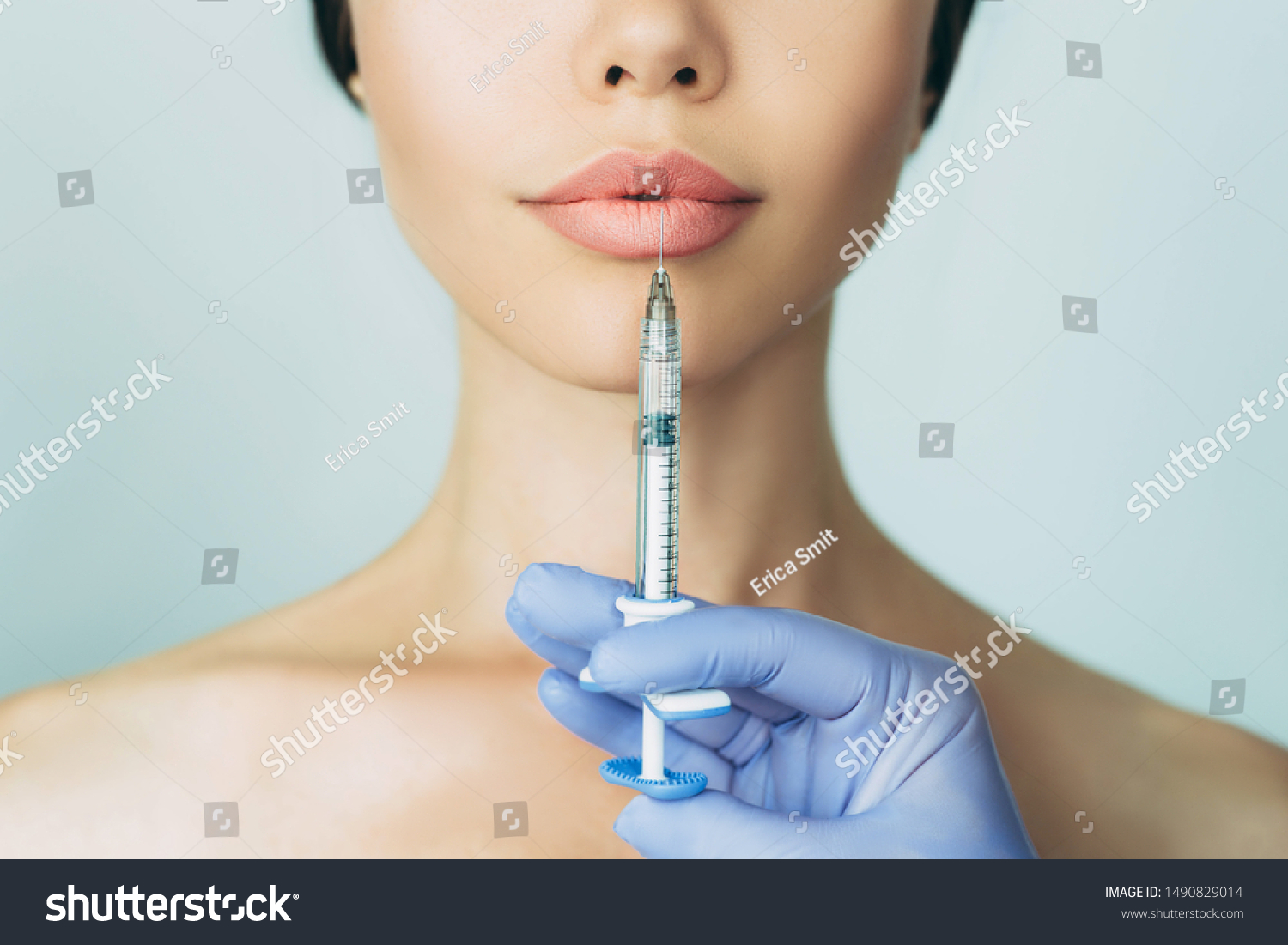 woman's plumper lips, getting bigger lips. prick of a syringe for the lips. injections for bigger volume #1490829014