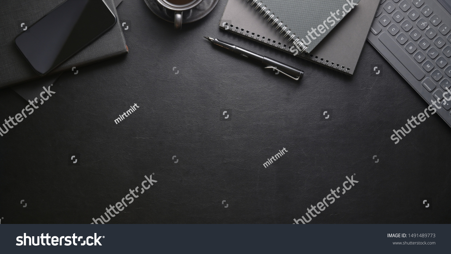 Top view of dark stylish workplace with smartphone and office supplies on black leather table background  #1491489773
