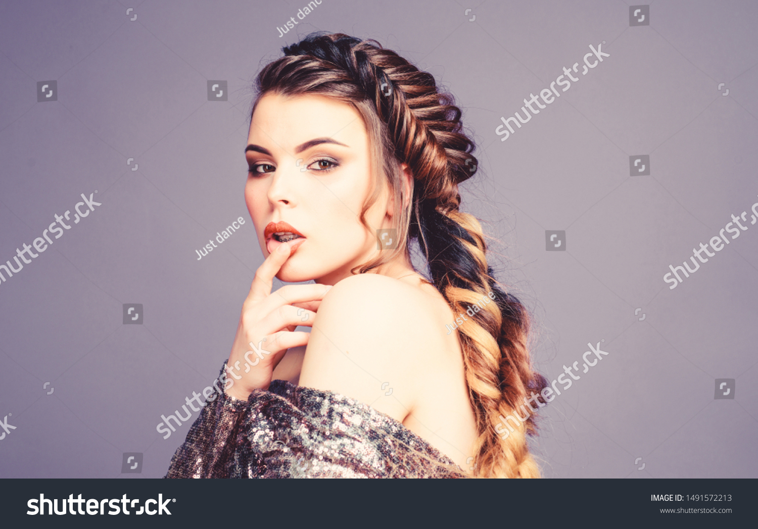 French braid. Professional hair care and creating hairstyle. Braided hairstyle. Beautiful young woman with modern hairstyle. Beauty salon hairdresser art. Girl makeup face braided long hair. #1491572213