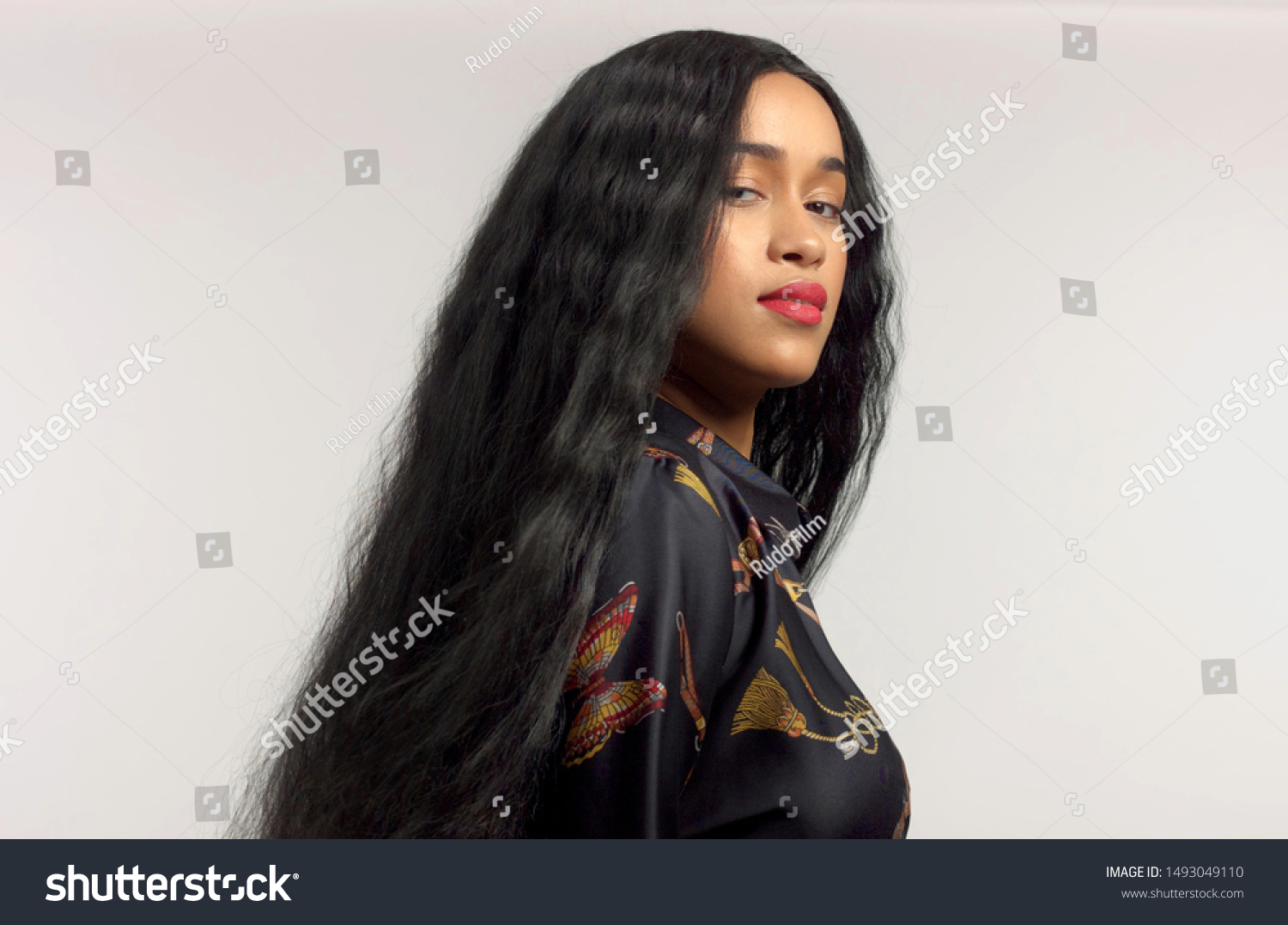 gorgeous mixed race model in studido shoot with long wavy wig on #1493049110
