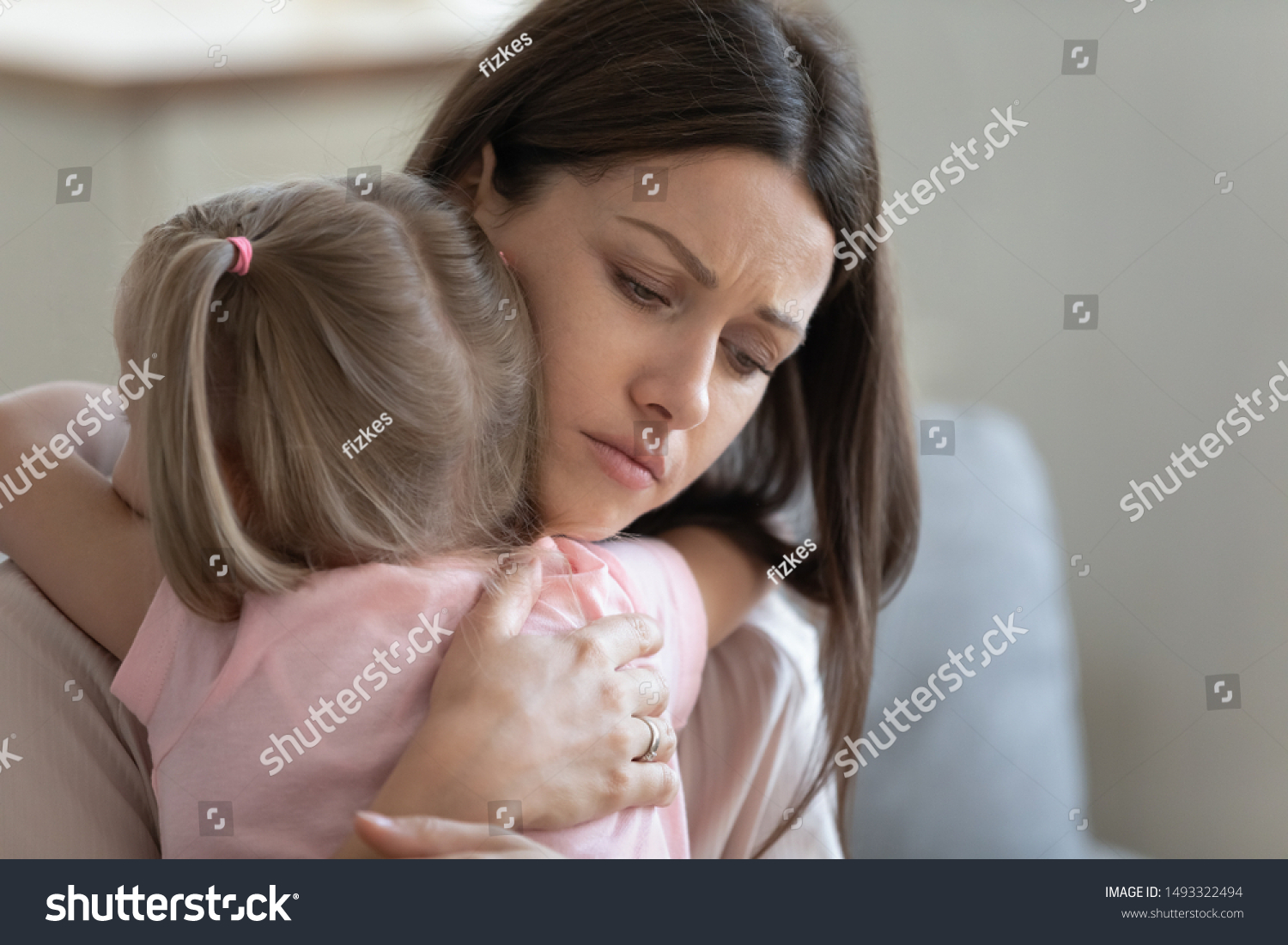 Attractive sad woman embraces little frustrated girl rear view, daughter snuggle to mother seeking for support and protection, concept of empathy and consoling or people make peace after scold concept #1493322494