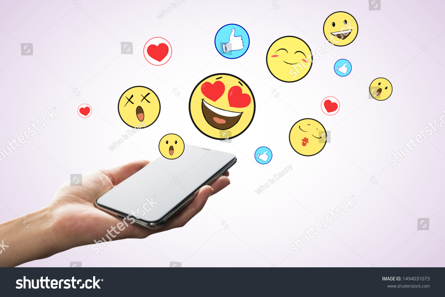 Hand holding smartphone with emotive on subtle background. Communication and emotion concept #1494031073