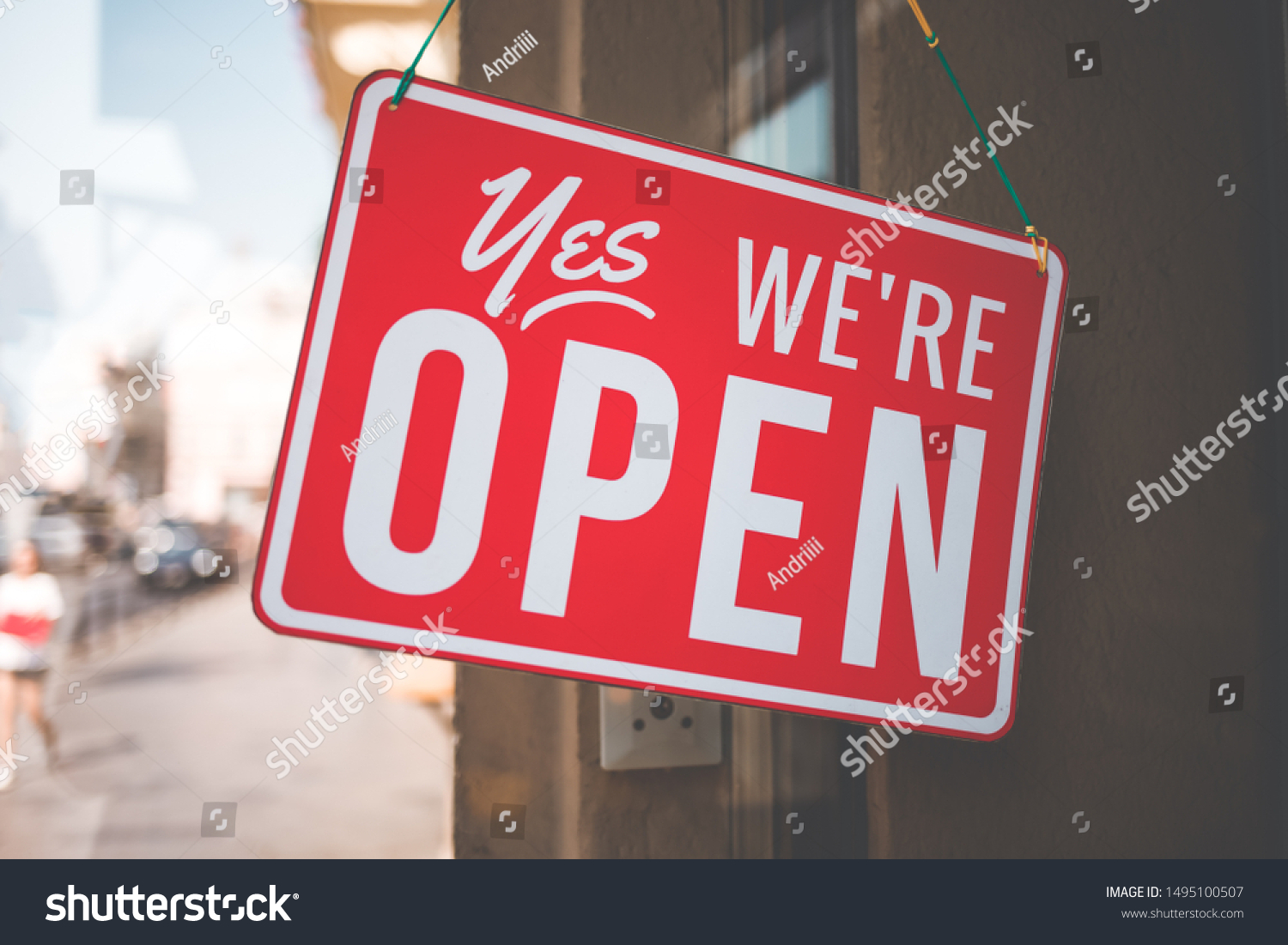 yes we're open sign on the glass of the doors in store.  welcome sign at the store #1495100507