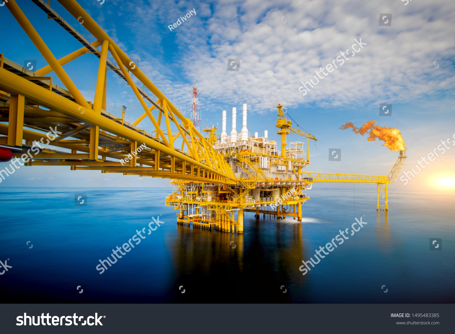 Large Offshore oil rig drilling platform at sunset and beautiful sky in the gulf of Thailand #1495483385