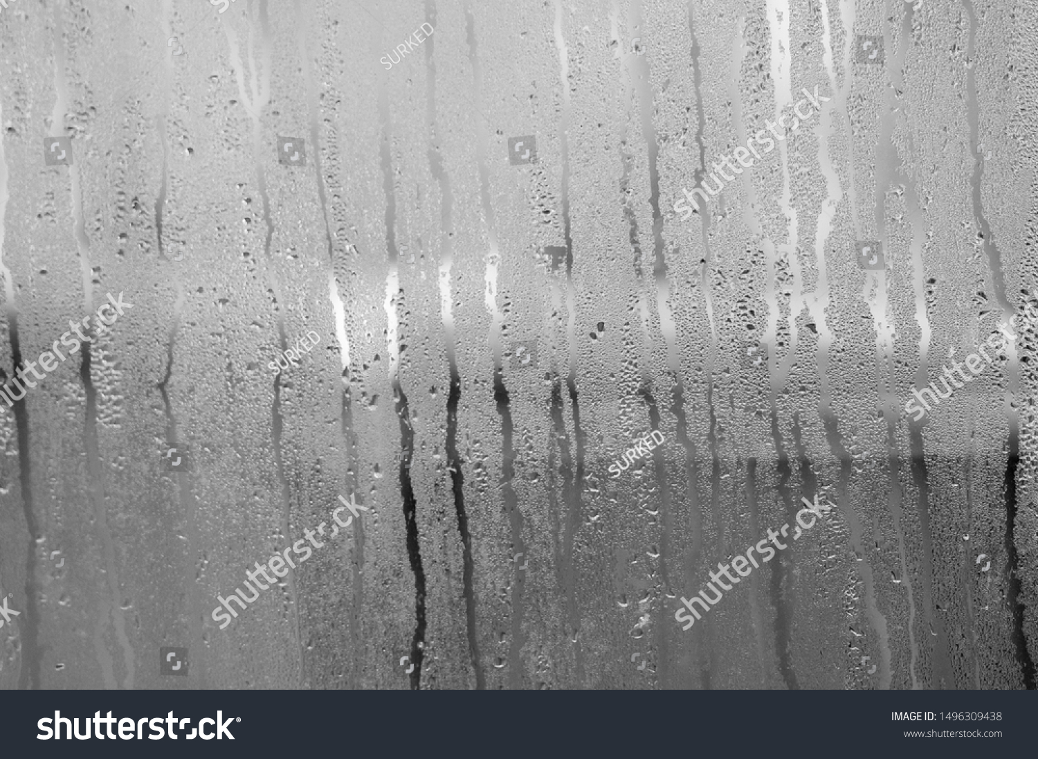 Transparent Glass with drops of water and can see through the glass outside but it is not clear. Vapour or steam on mirror when raining #1496309438