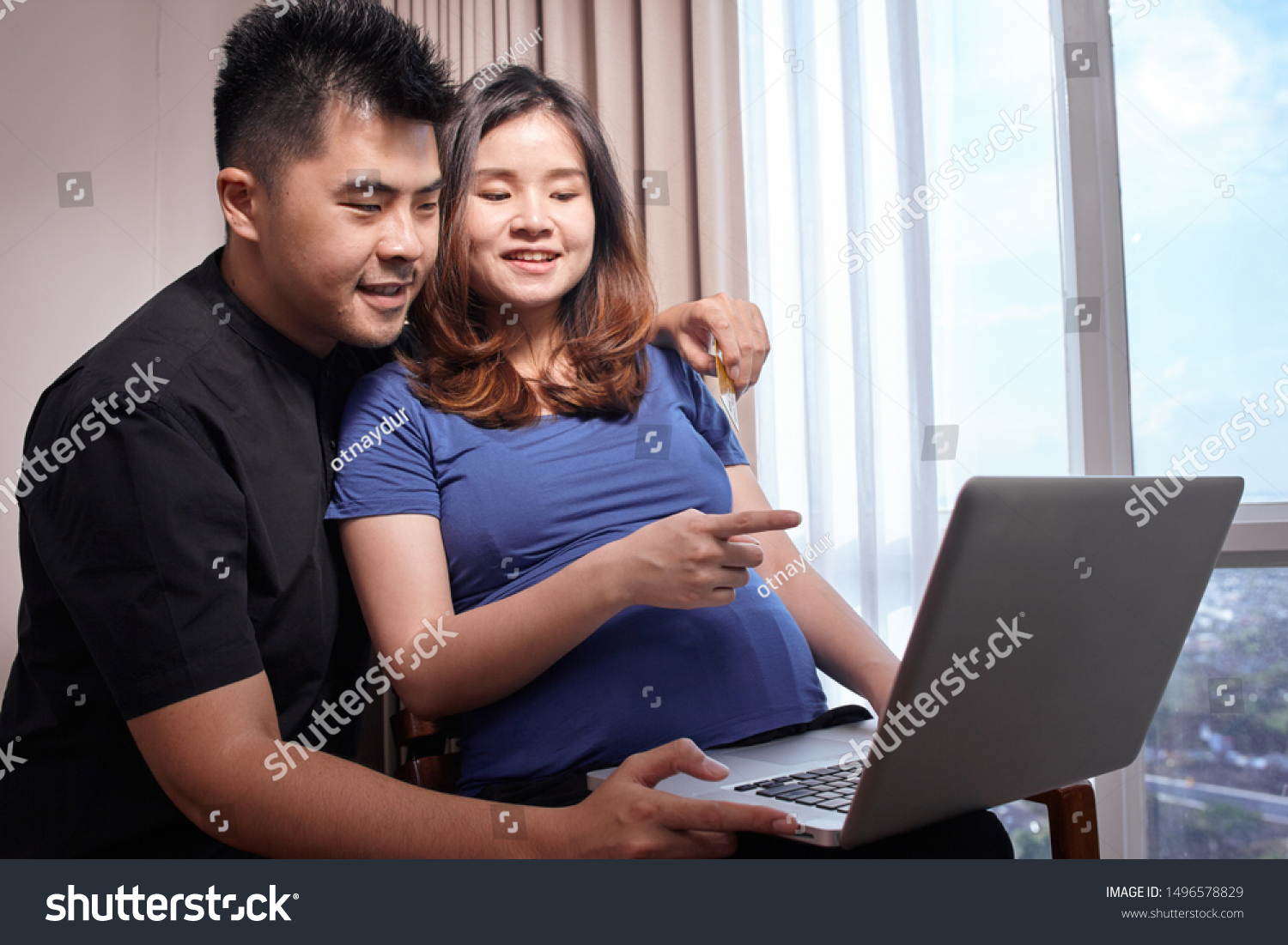Asian young couple buying online to prepare for the baby #1496578829