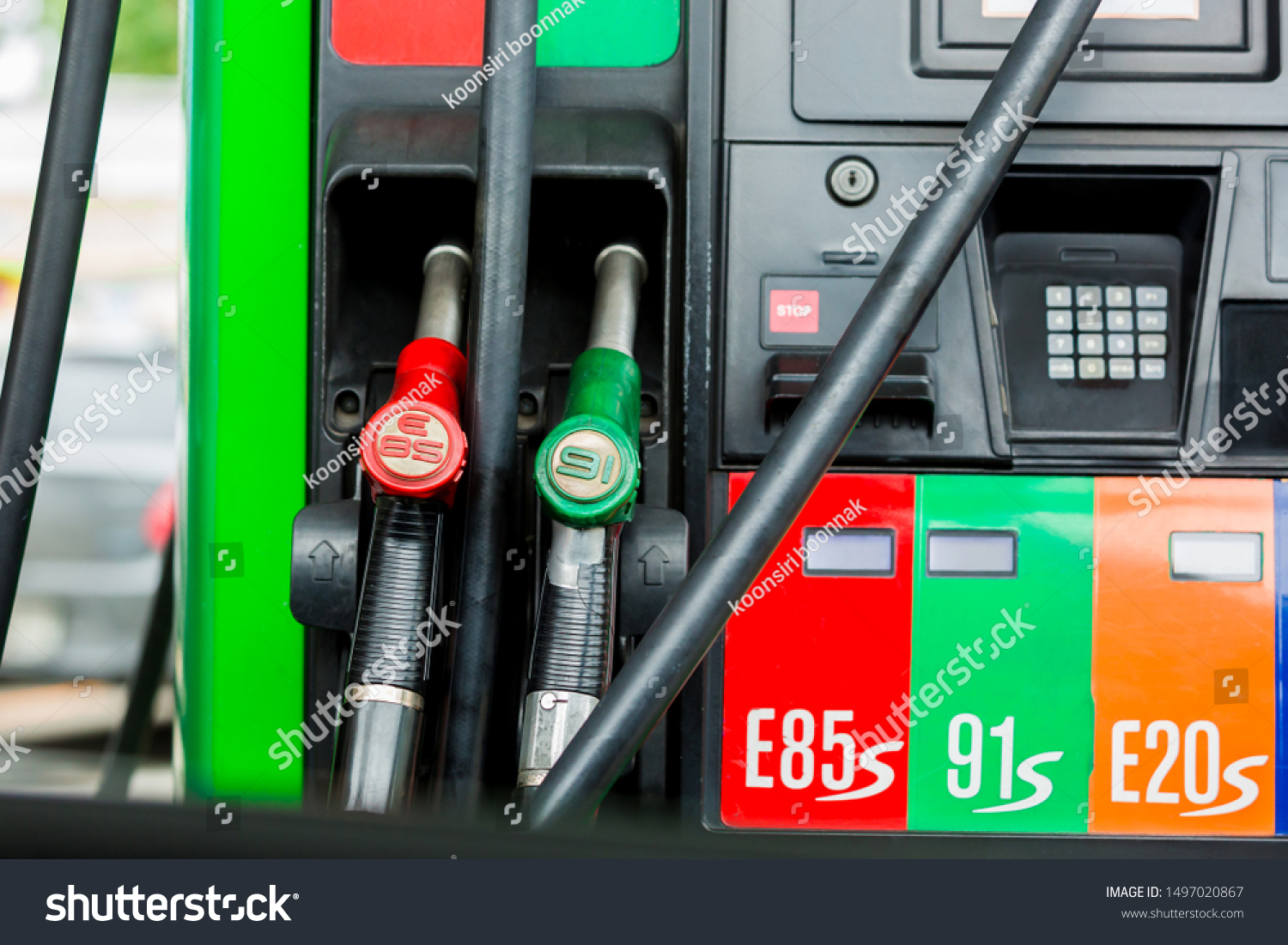 Gas pump nozzles in a service station, Close up fuel nozzles at gas station, Panel and Dashboard of fuel nozzles of E85 E20 and Gasohol 91. The concept of fuel energy. #1497020867