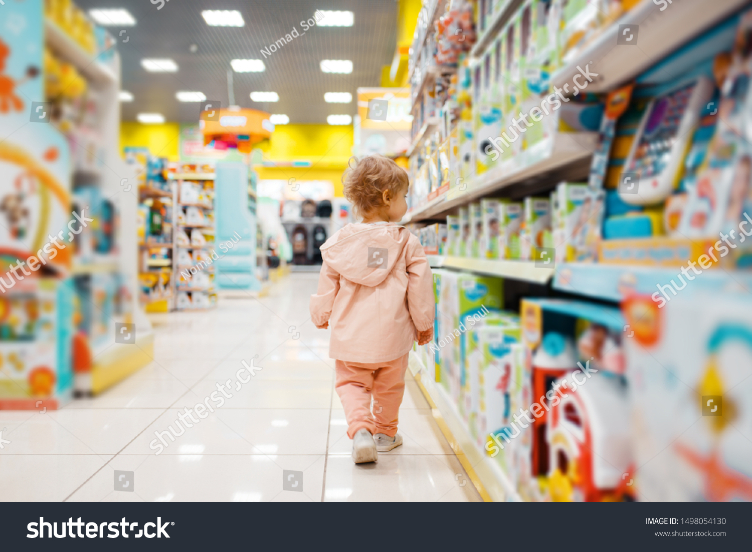 Little girl choosing toys in kids store #1498054130