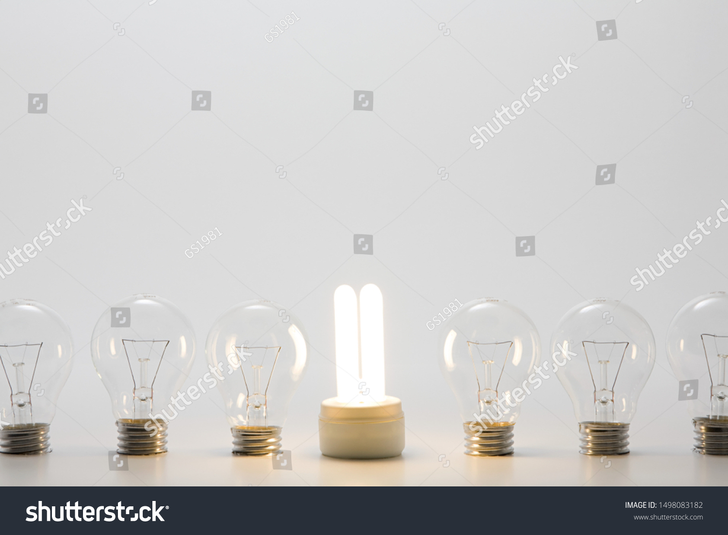 An energy saving lightbulb and ordinary lightbulbs #1498083182