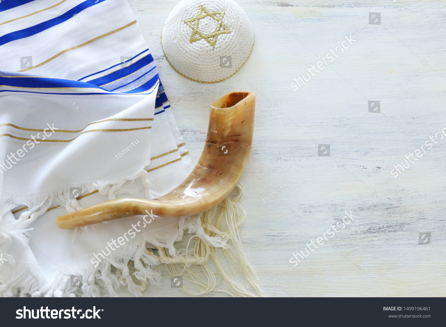 religion image of Prayer Shawl - Tallit, Prayer book and Shofar (horn) jewish religious symbols. Rosh hashanah (jewish New Year holiday), Shabbat and Yom kippur concept. #1499196461