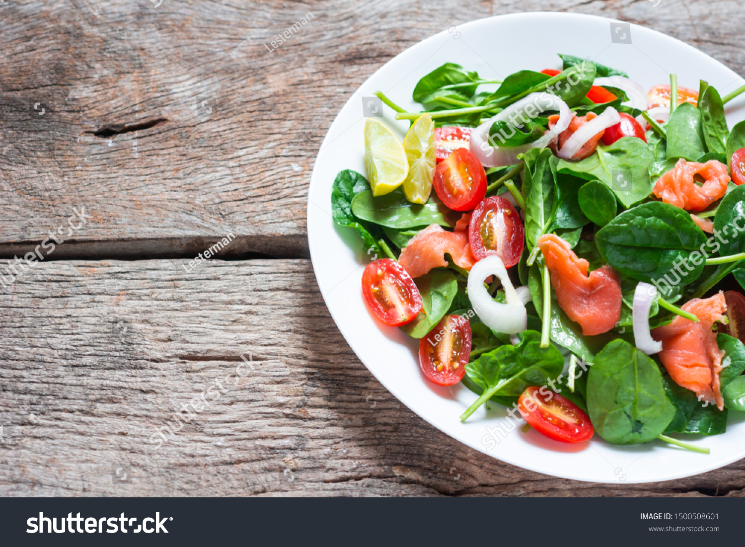 Selective focus Salmon Fresh green Salad with spinach, cherry tomatoes,baby spinach,  Concept for a tasty and healthy meal. Dark stone background. Top view. Close up. #1500508601