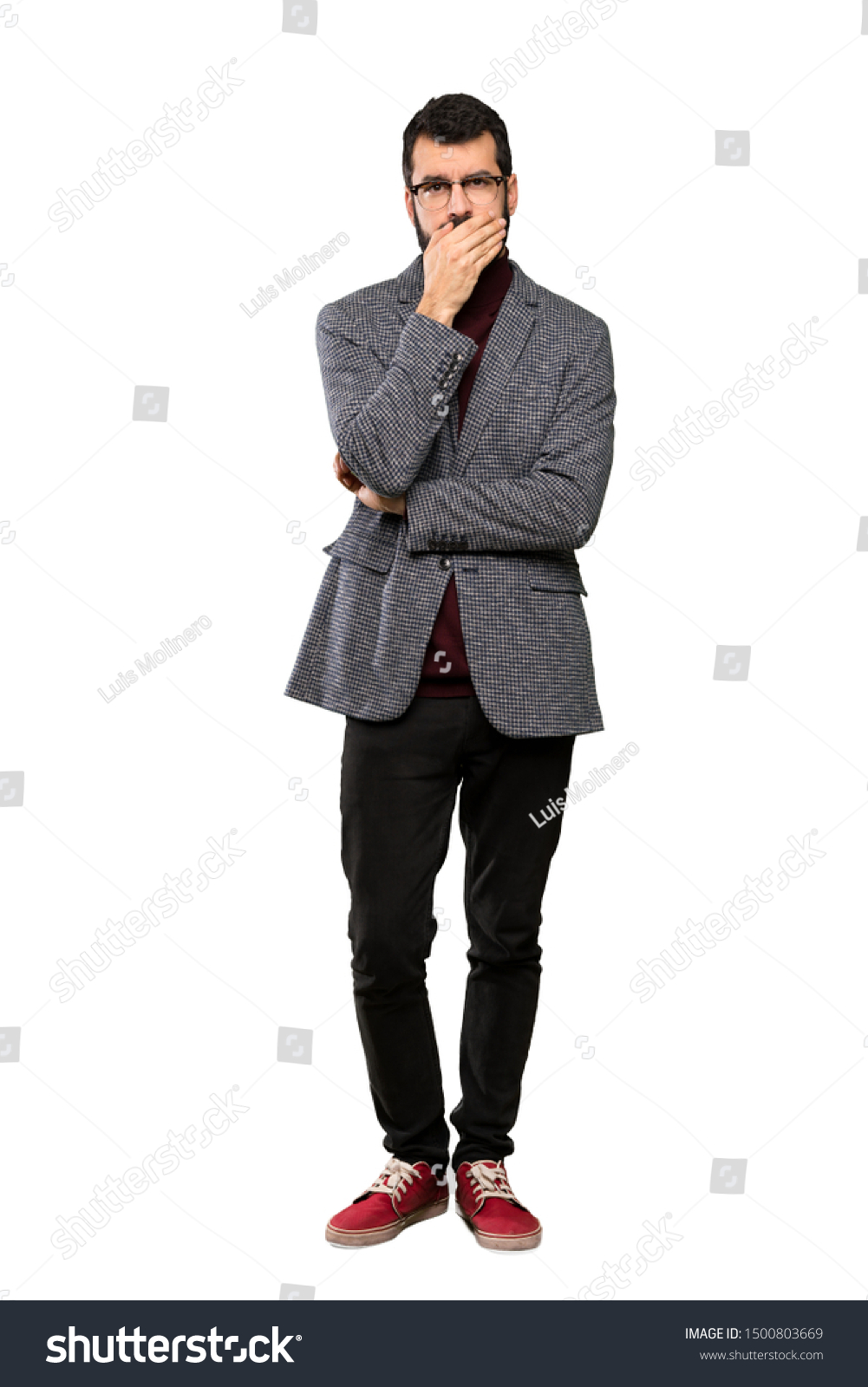 Handsome man with glasses covering mouth with hands over isolated white background #1500803669