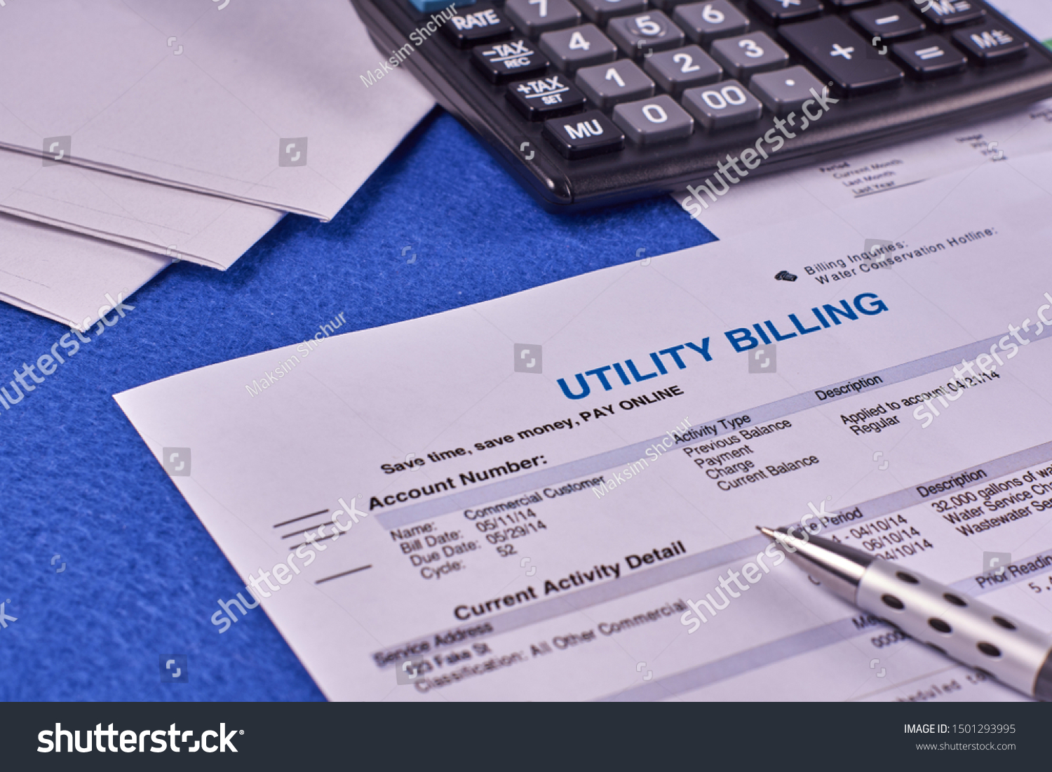 Communal payments. Utility billing sheet, calculator, pen and envelopes on a blue velvet background #1501293995