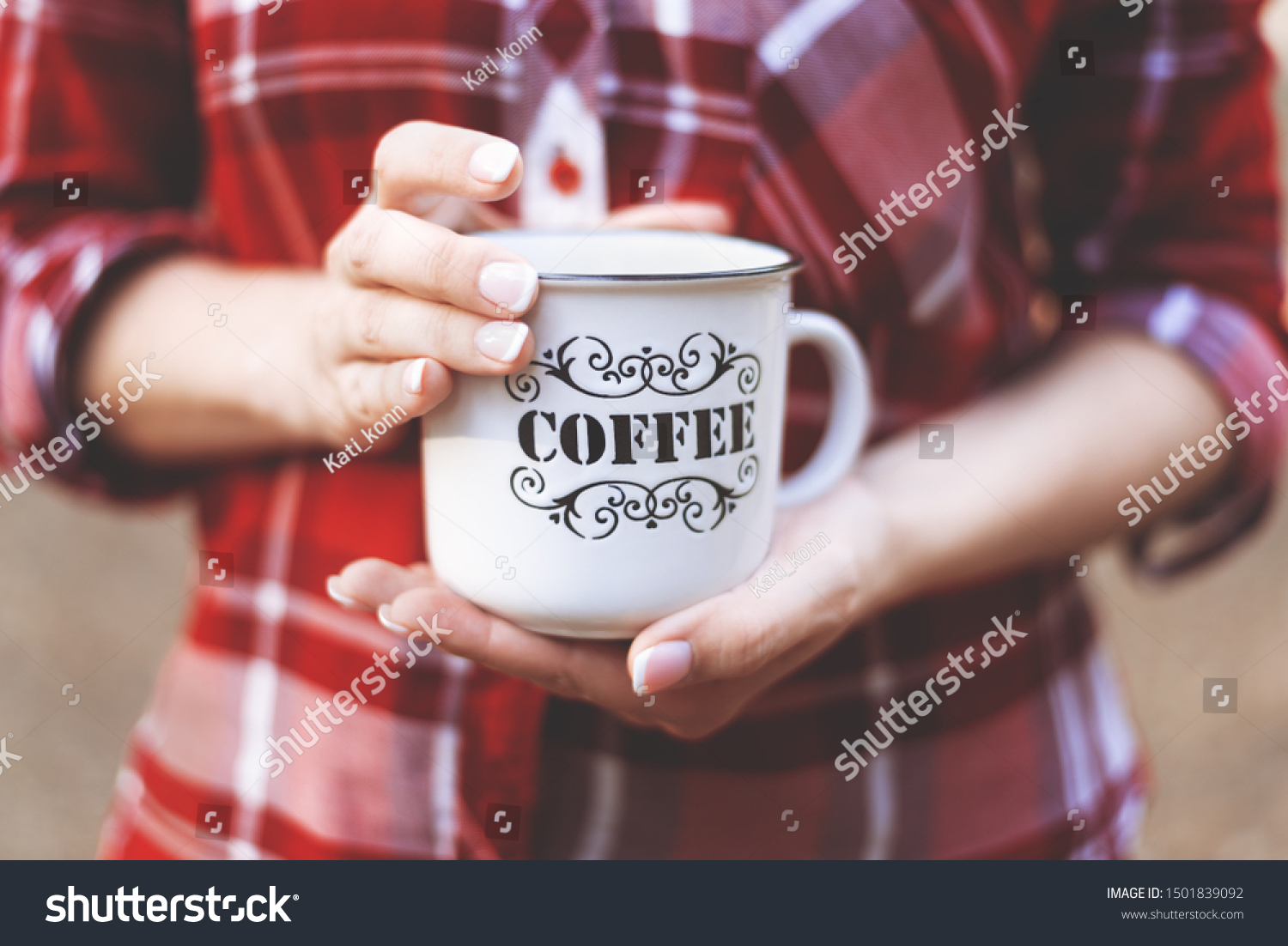 hands holding a Cup with the inscription coffee #1501839092