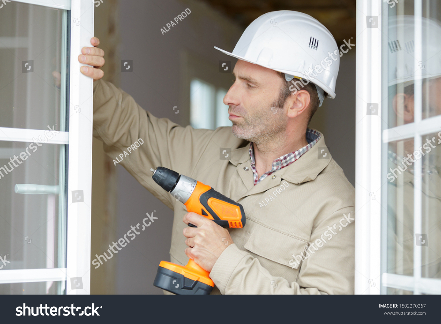 close up of a man working with drill #1502270267