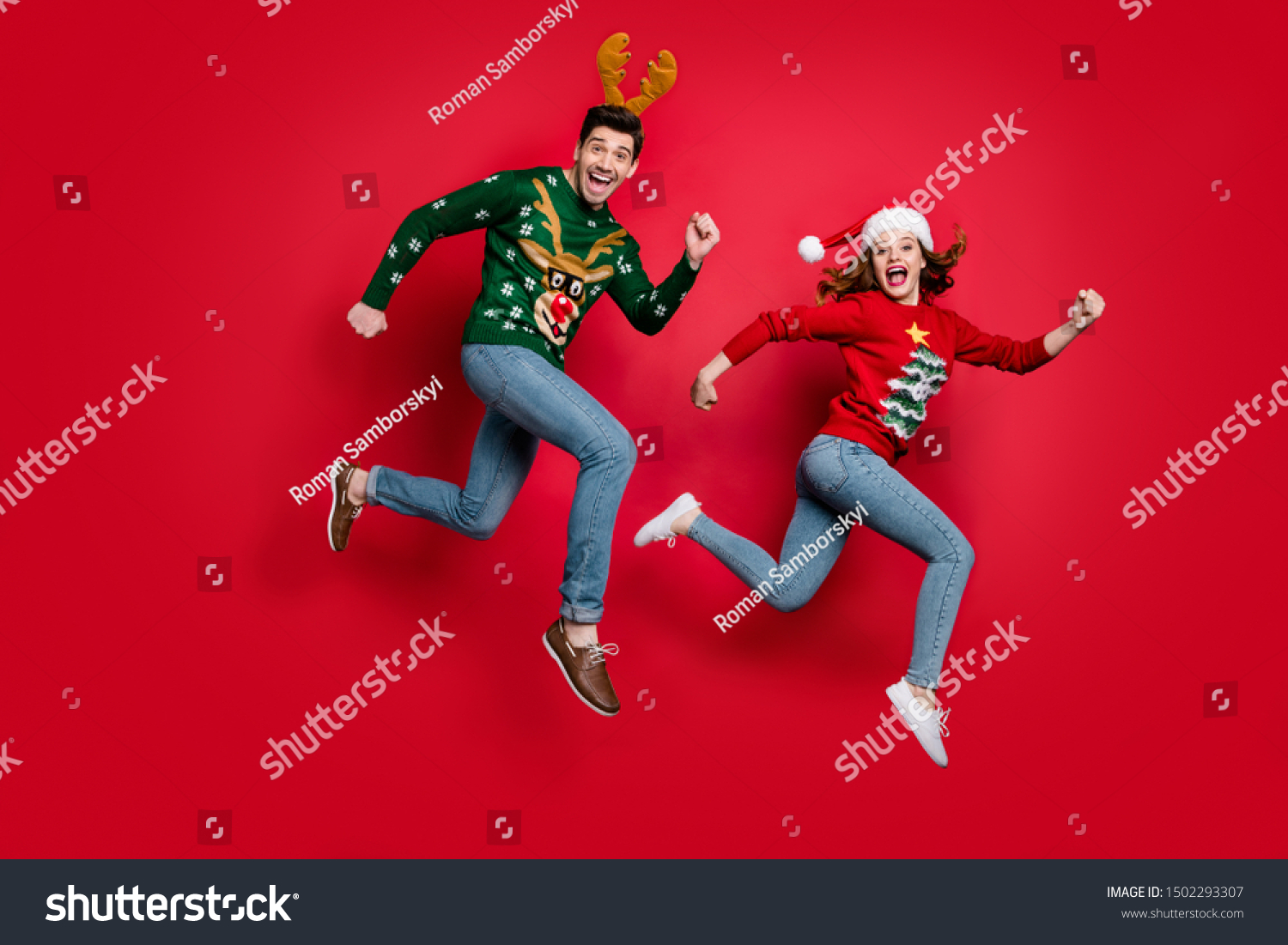 Full length photo of crazy jumping couple excited by x-mas discounts prices wear ugly ornament jumpers isolated red color background #1502293307