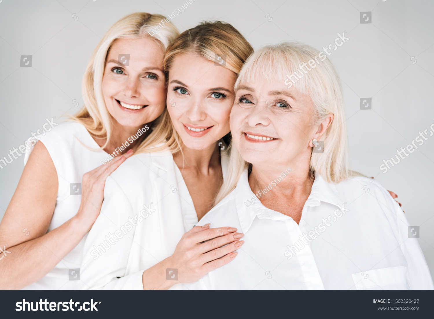 cheerful three generation blonde women isolated on grey #1502320427