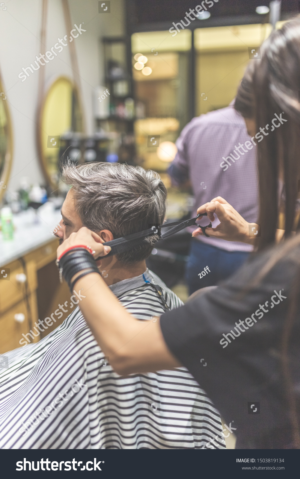 Men hairstyling and haircut in a barber shop or hair salon. #1503819134