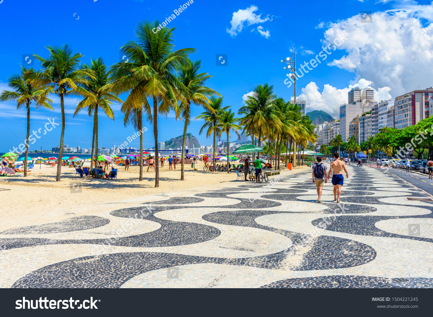 View of Copacabana beach and Leme beach with palms and mosaic of sidewalk in Rio de Janeiro, Brazil. Copacabana beach is the most famous beach of Rio de Janeiro, Brazil. cityscape of Rio de Janeiro #1504221245