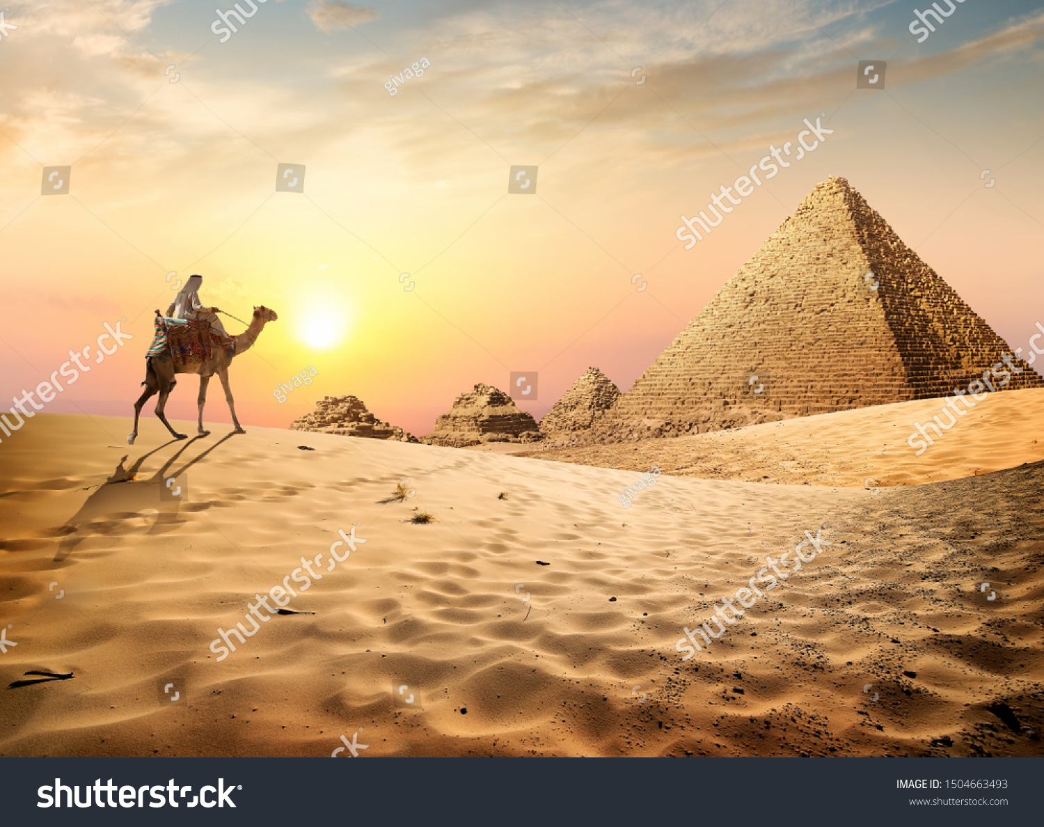 Egyptian pyramids in the desert at sunset #1504663493