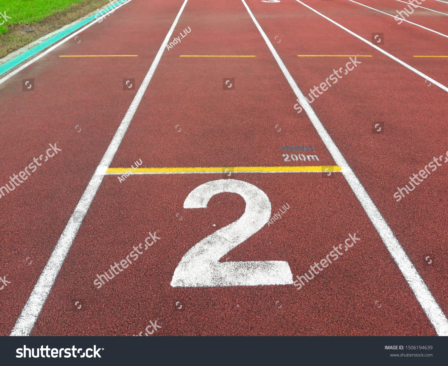The number at start point of running track or athlete track in stadium (2). Running track is a rubberized artificial running surface for track and field athletics.  #1506194639