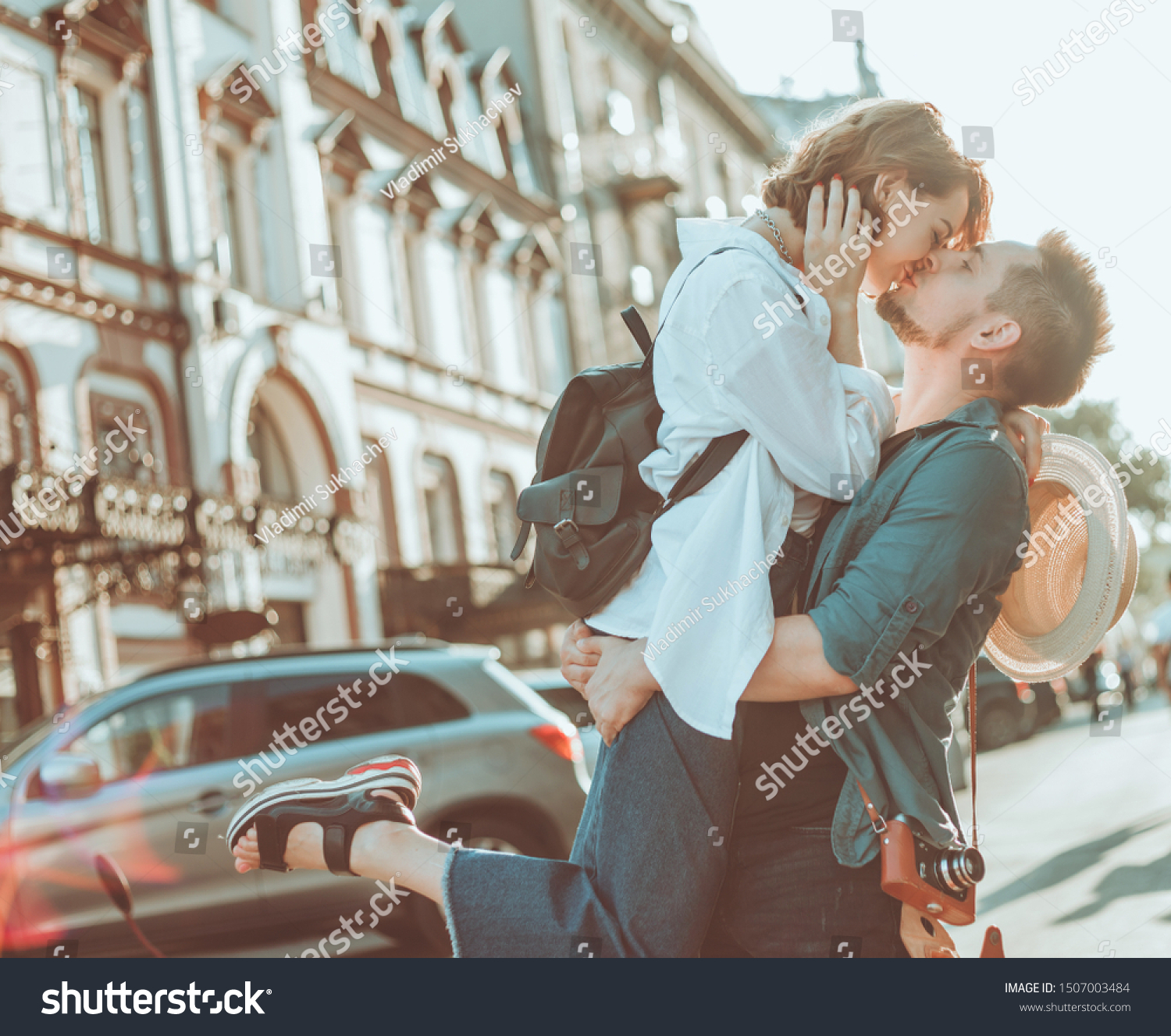 Cheerful cheerful hipster couple in love kissing at city. The romantic concept of lovers. love story #1507003484