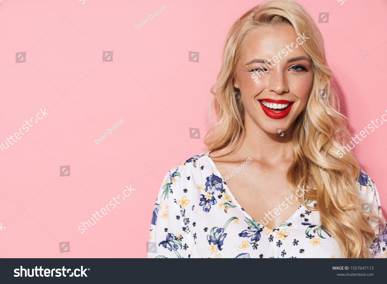 Image of gorgeous woman with long blond hair smiling and winking at camera isolated over pink background #1507647113